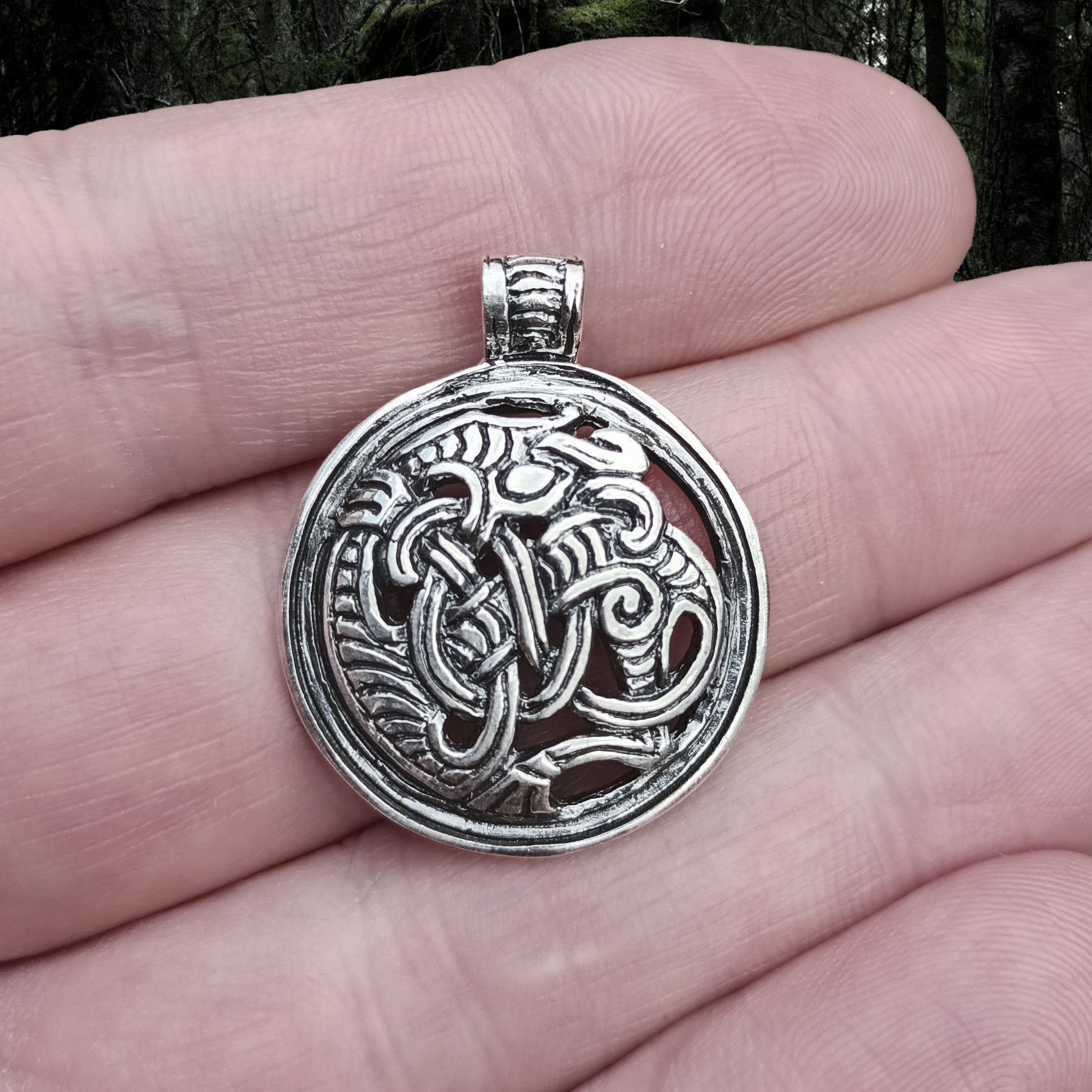 Round Dragon Beast Pendant in Silver on Hand - Viking Jewelry from The Viking Dragon