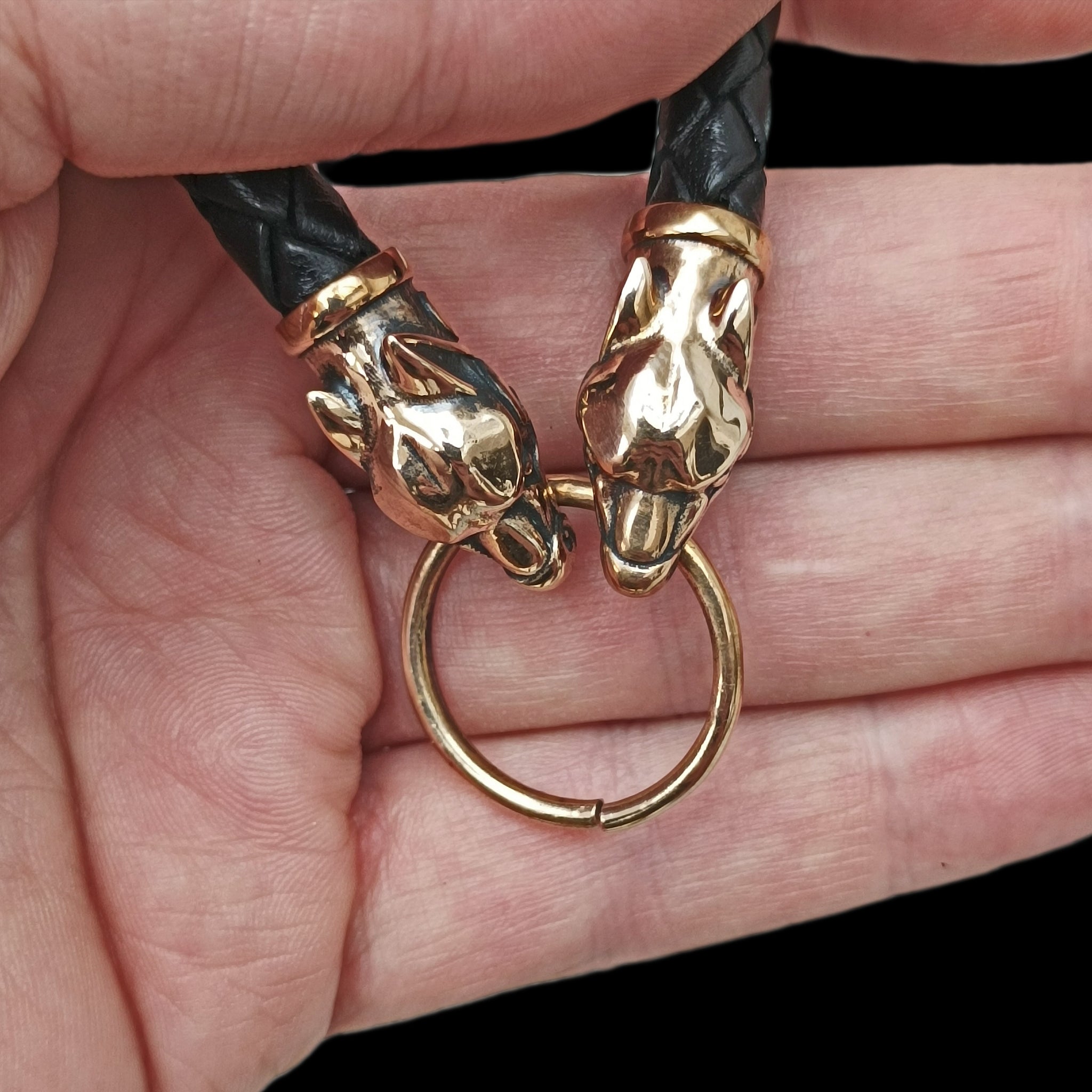 8mm Width Braided Leather Necklace with Bronze Ferocious Wolf Heads and Split Ring in Hand