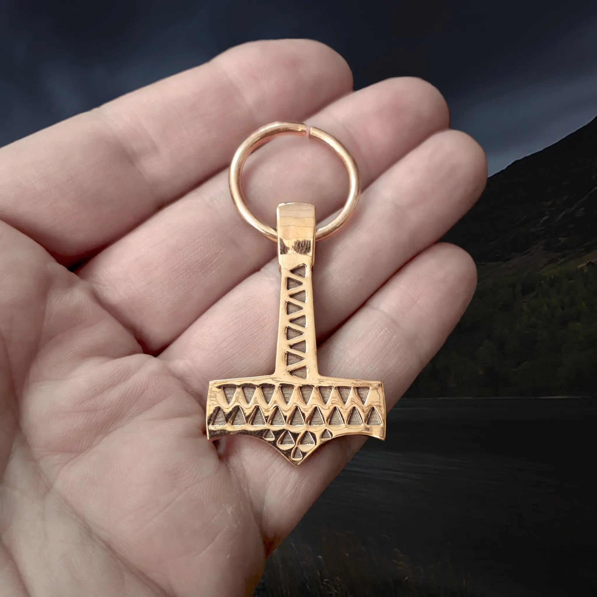 Medium Bronze Split Ring for Bronze Necklaces / Pendants Holding a Bronze Valse Thor's Hammer Pendant Replica on Hand