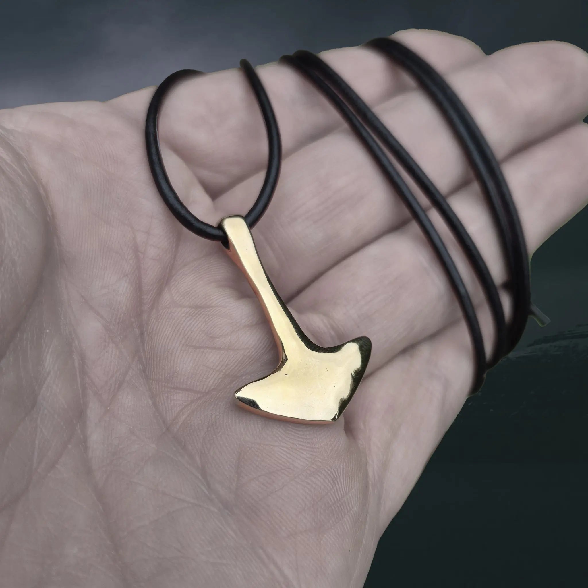 Bronze Replica Thor's Hammer Pendant from Repton, England, UK on Leather Cord, on Hand