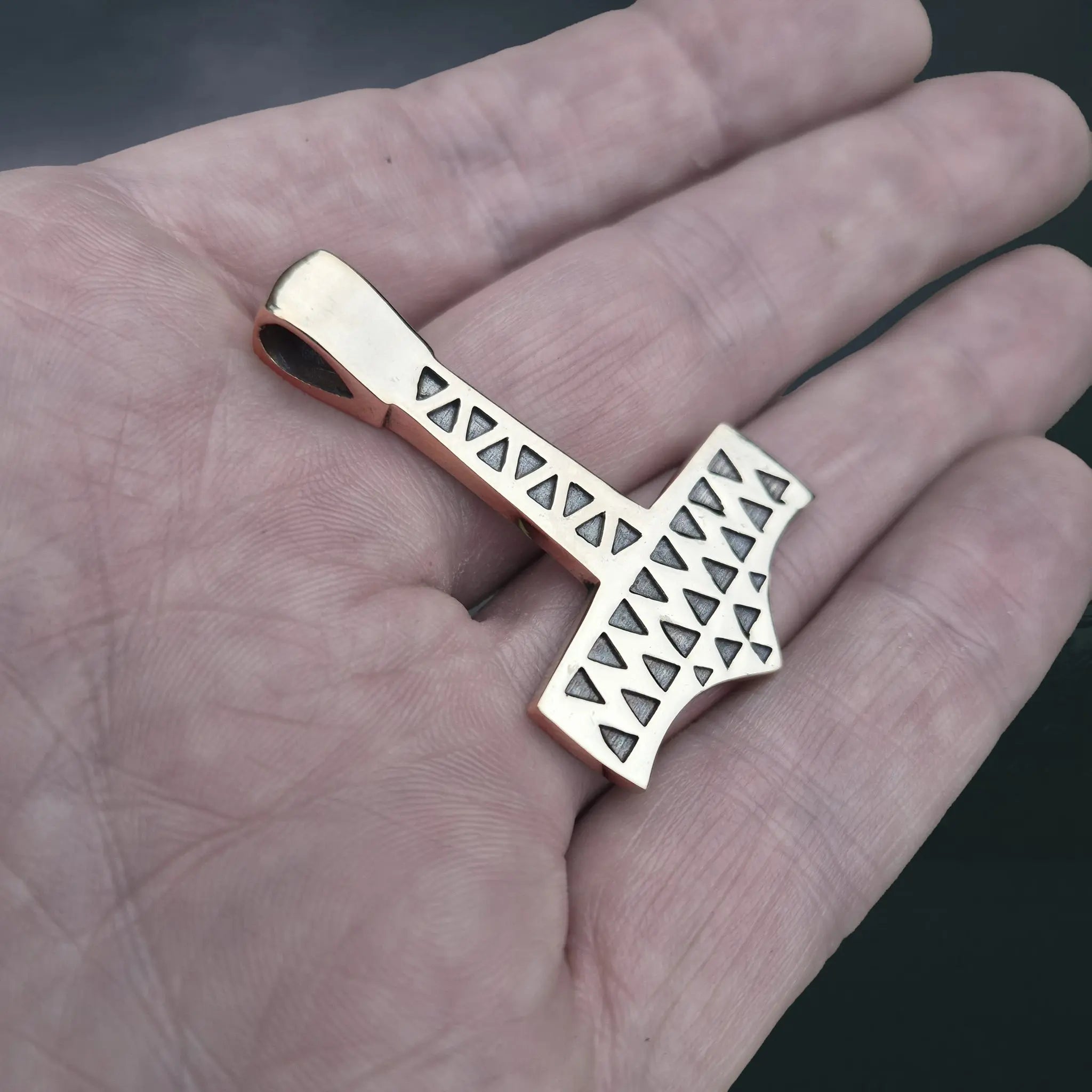 Bronze Thors Hammer Pendant Replica from Vålse, Denmark on Hand - Side Angle View