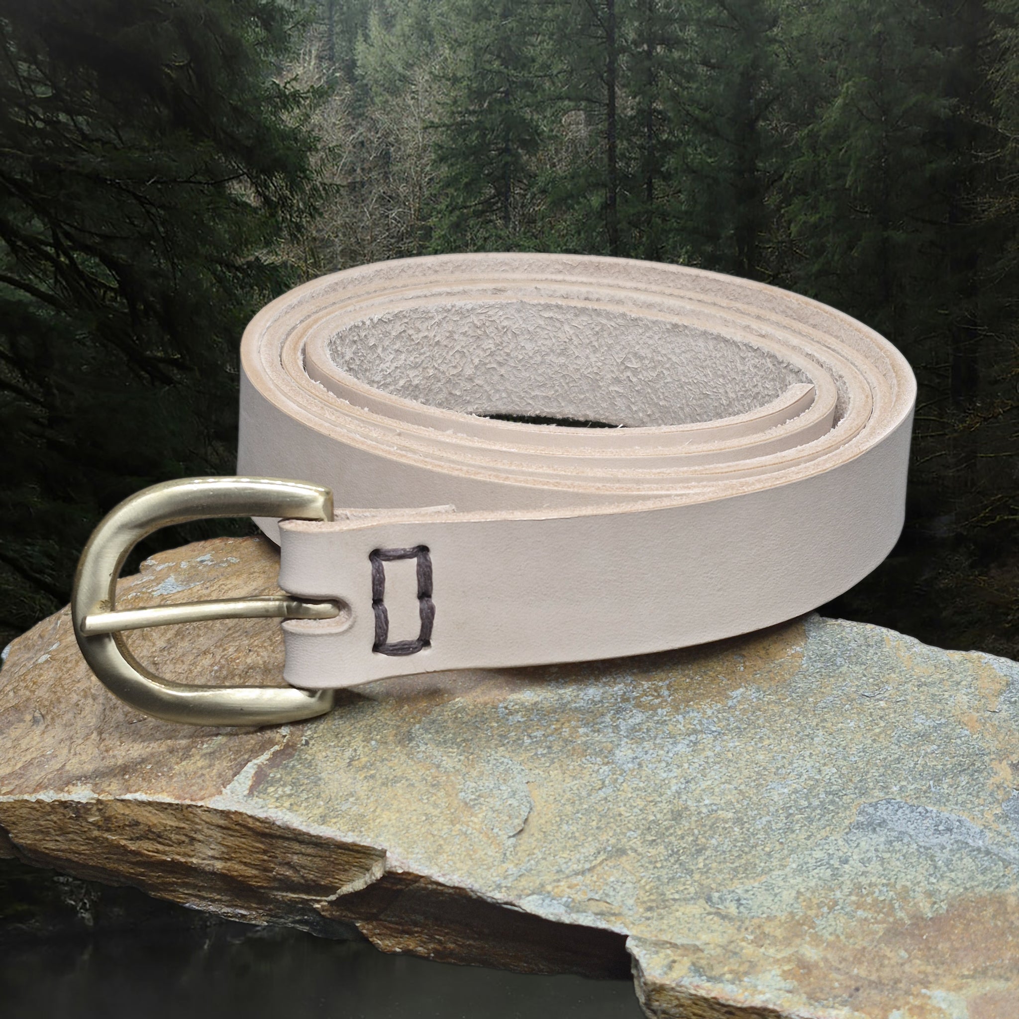 Long Leather Natural Veg Tan Viking Belt with 32mm Wide Brass Buckle on Rock