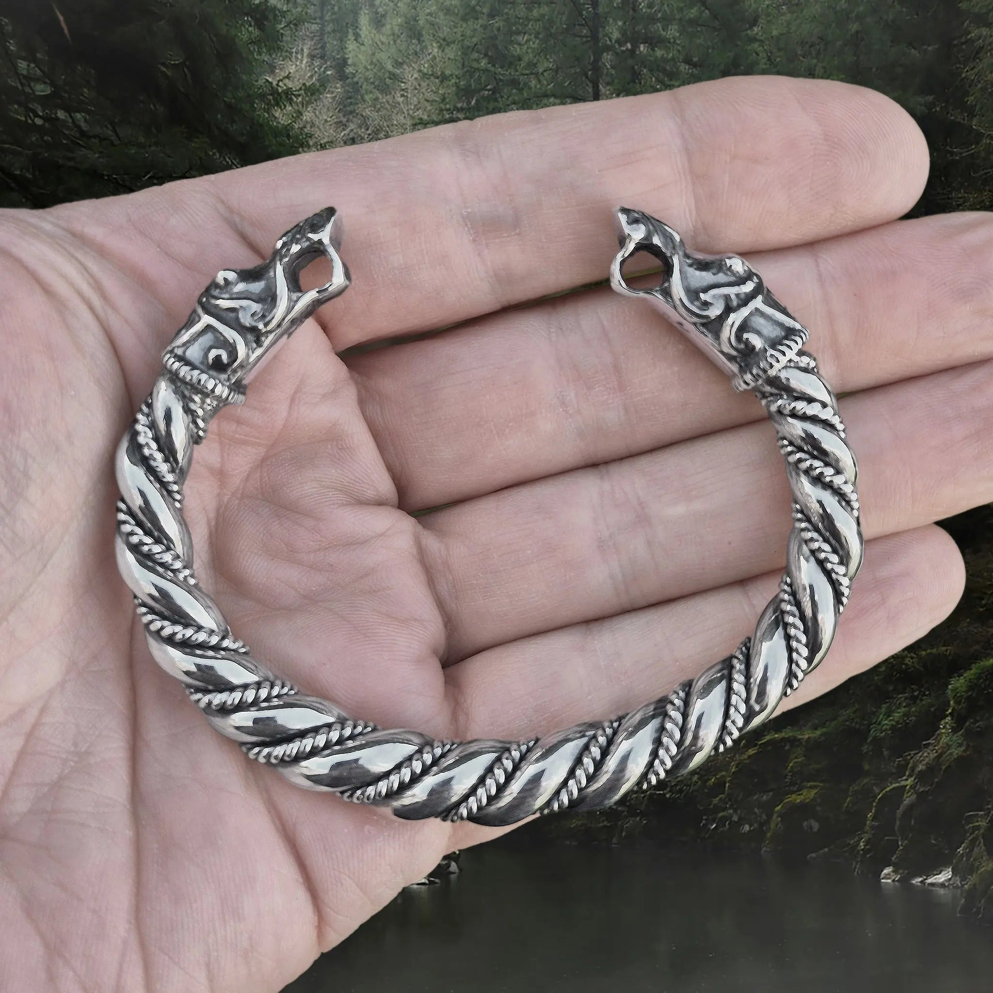Thick Twisted Silver Arm Ring With Gotlandic Dragon Heads on Hand