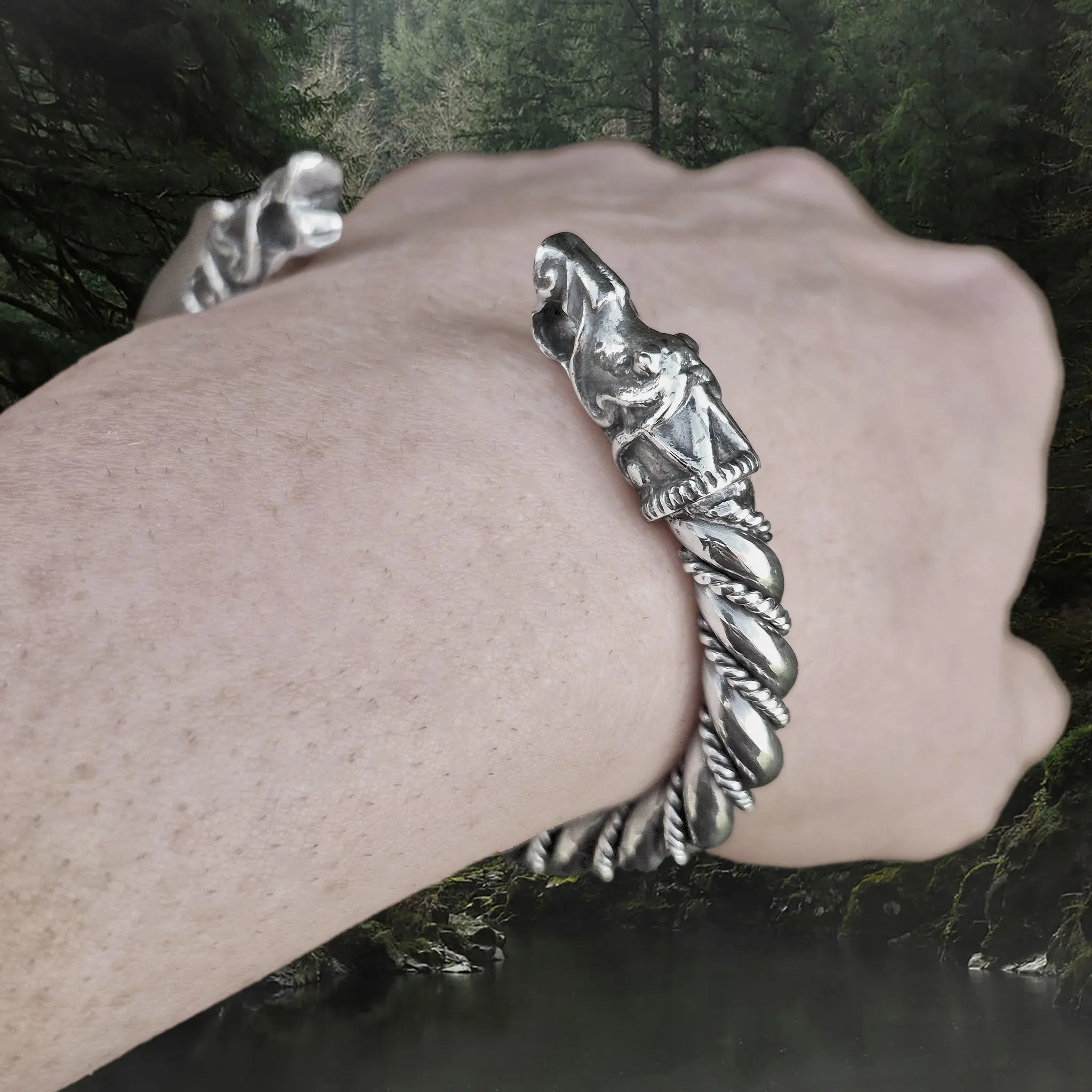 Thick Twisted Silver Arm Ring With Gotlandic Dragon Heads on Wrist - Angle View