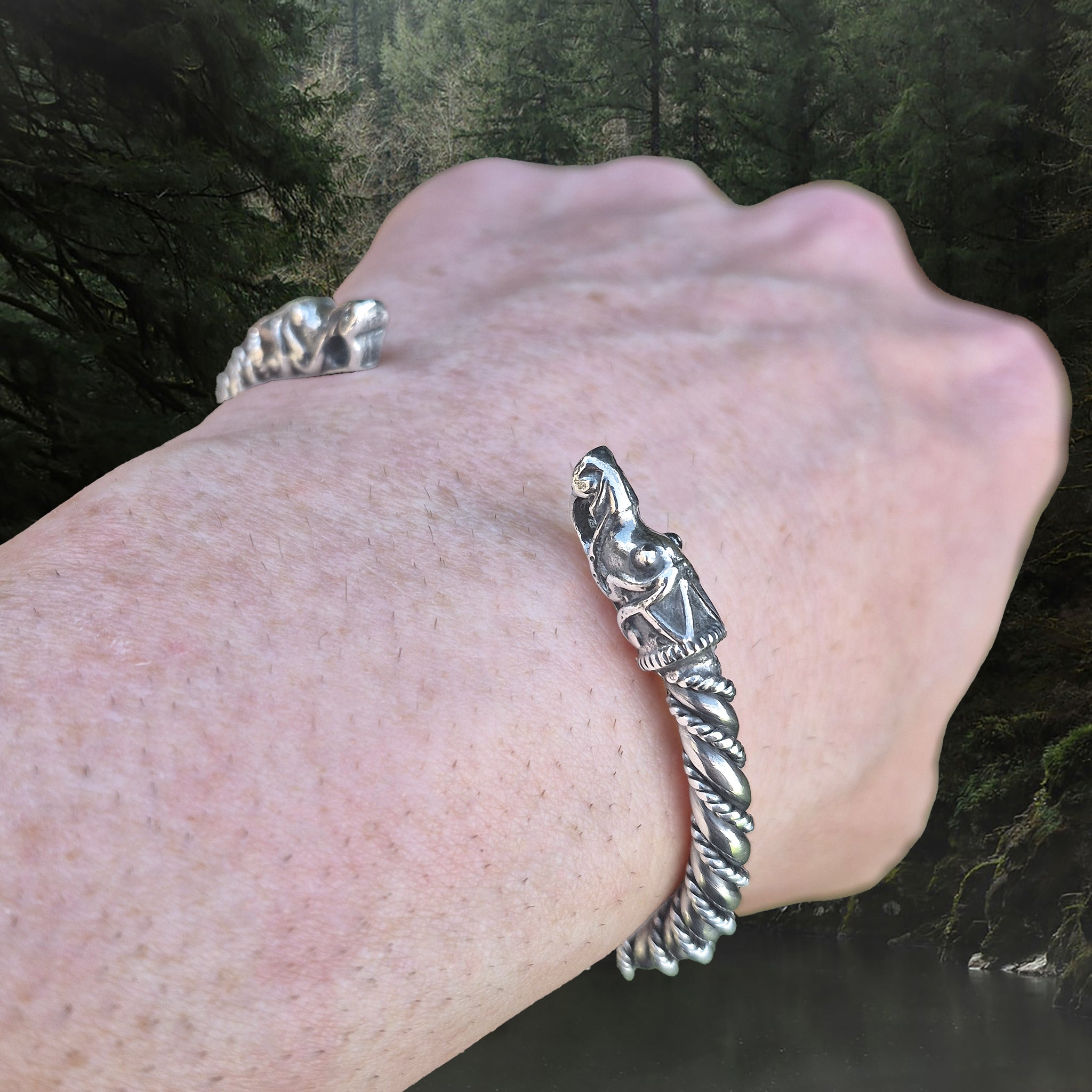 6mm Thick Twisted Silver Bracelet With Gotlandic Dragon Heads on Wrist - Angle View