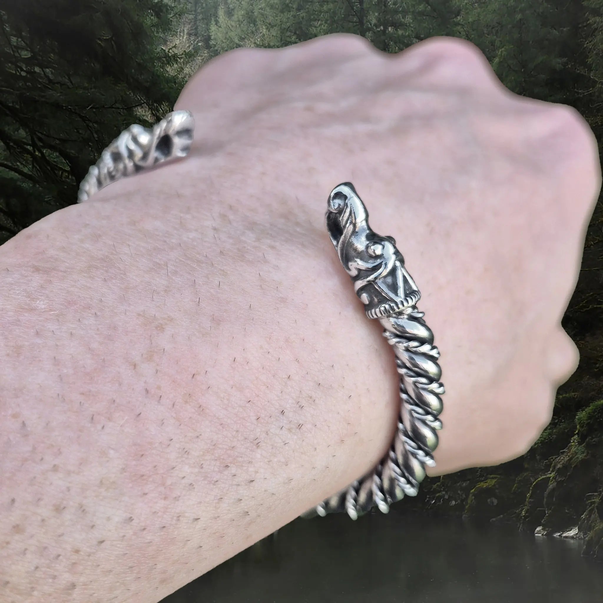 Twisted Silver Arm Ring / Bracelet With Gotlandic Dragon Heads on Wrist - Angle View
