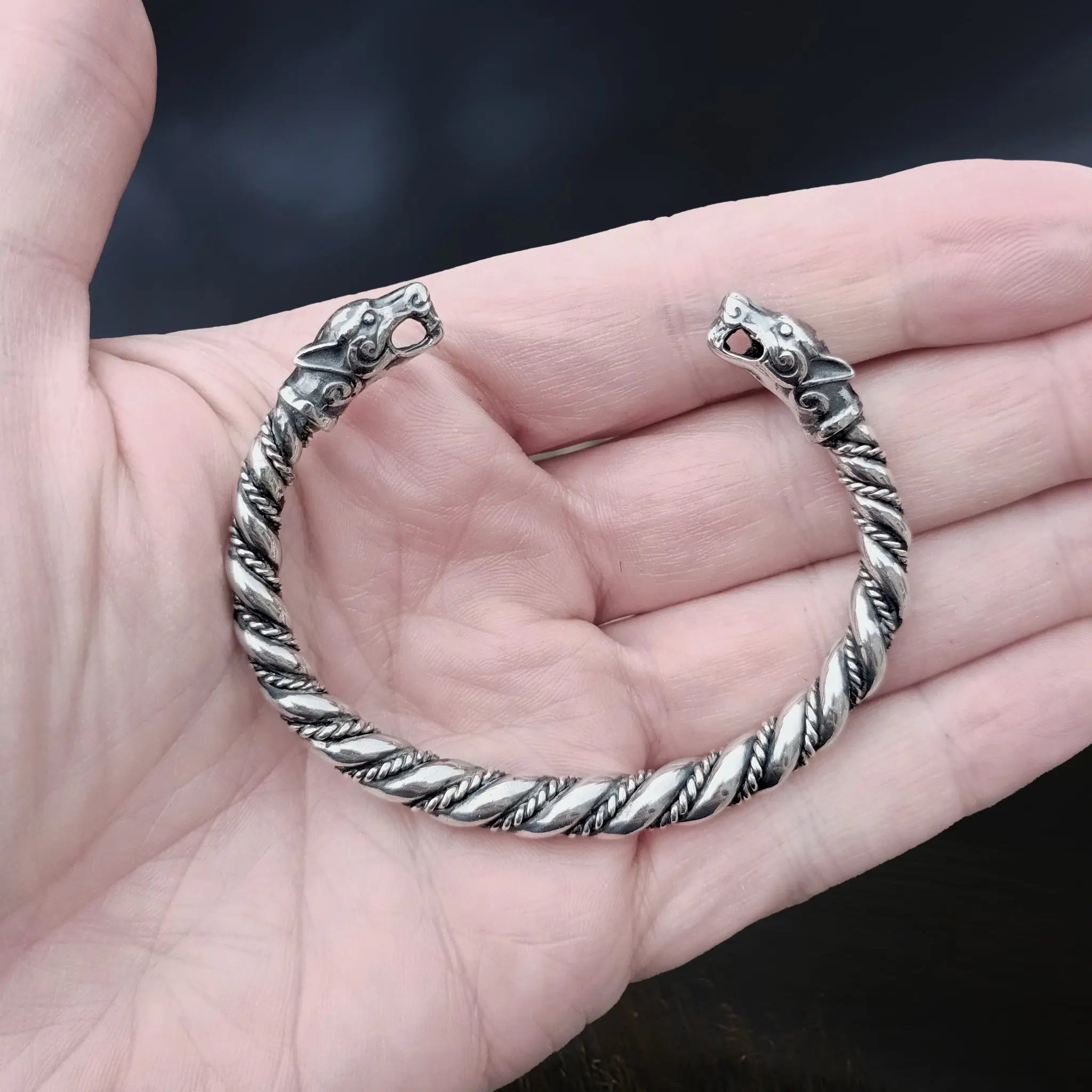 Twisted Silver Viking Bracelet / Arm Ring With Ferocious Wolf Heads on Hand