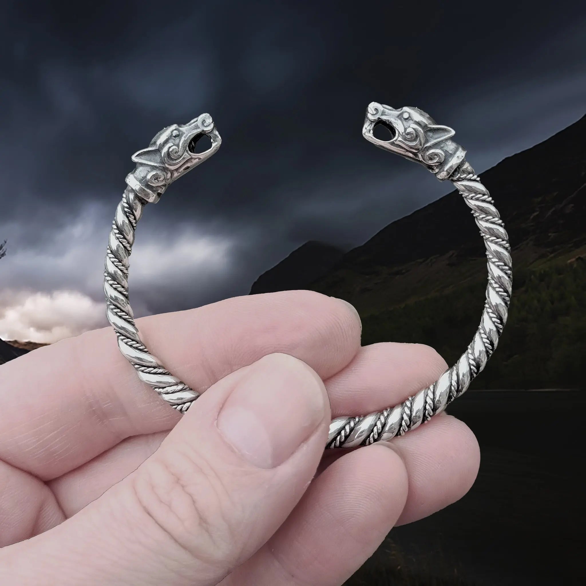Twisted Silver Viking Bracelet With Ferocious Wolf Heads in Hand