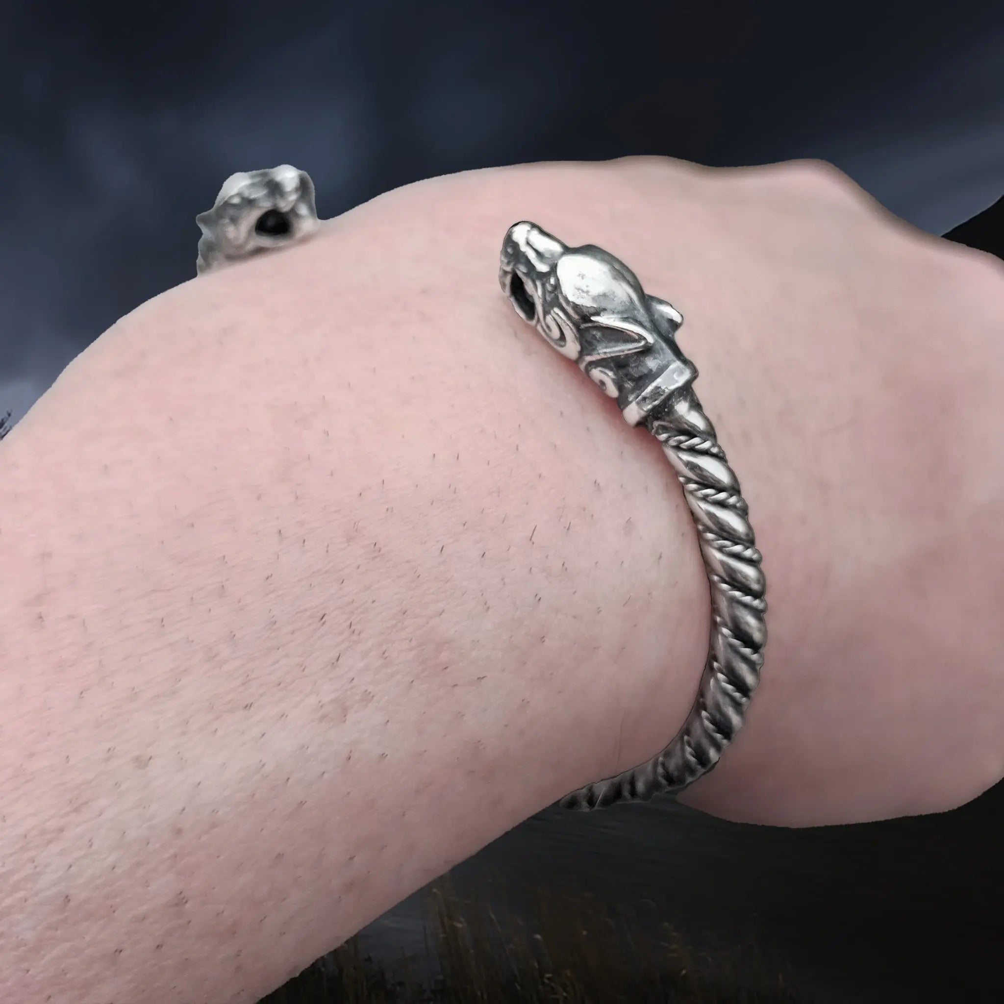 Twisted Silver Viking Bracelet With Ferocious Wolf Heads on Wrist - Close Up Angle View