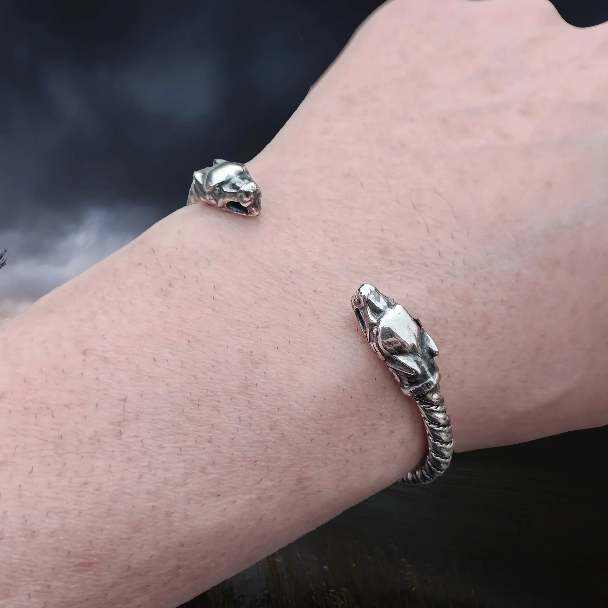 Twisted Silver Viking Bracelet With Ferocious Wolf Heads on Wrist