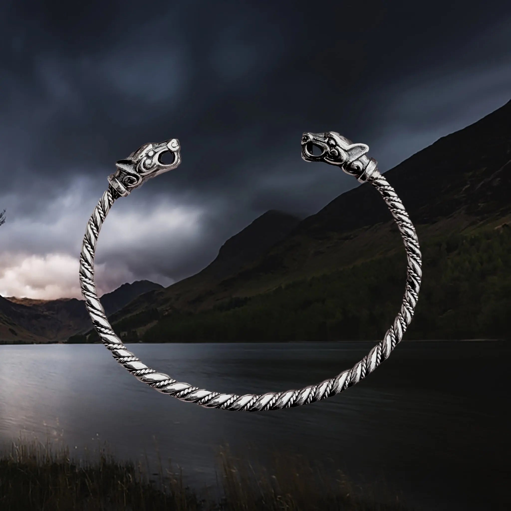Slim Twisted Silver Viking Bracelet With Ferocious Wolf Heads
