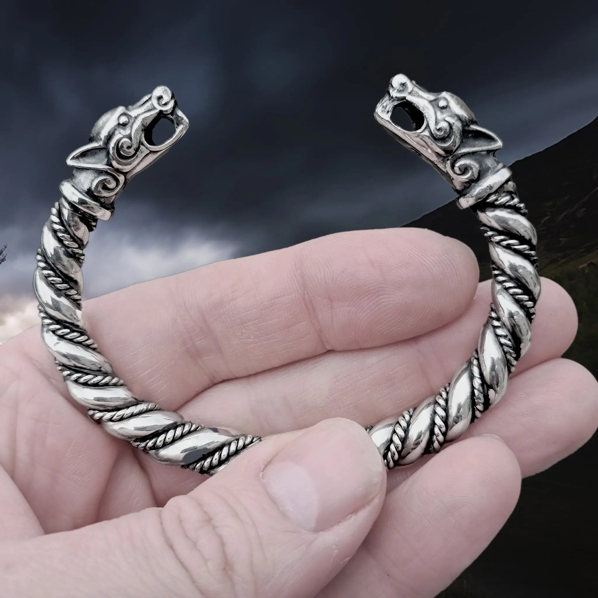 Thick Twisted Silver Viking Bracelet / Arm Ring With Ferocious Wolf Heads in Hand - Close Up