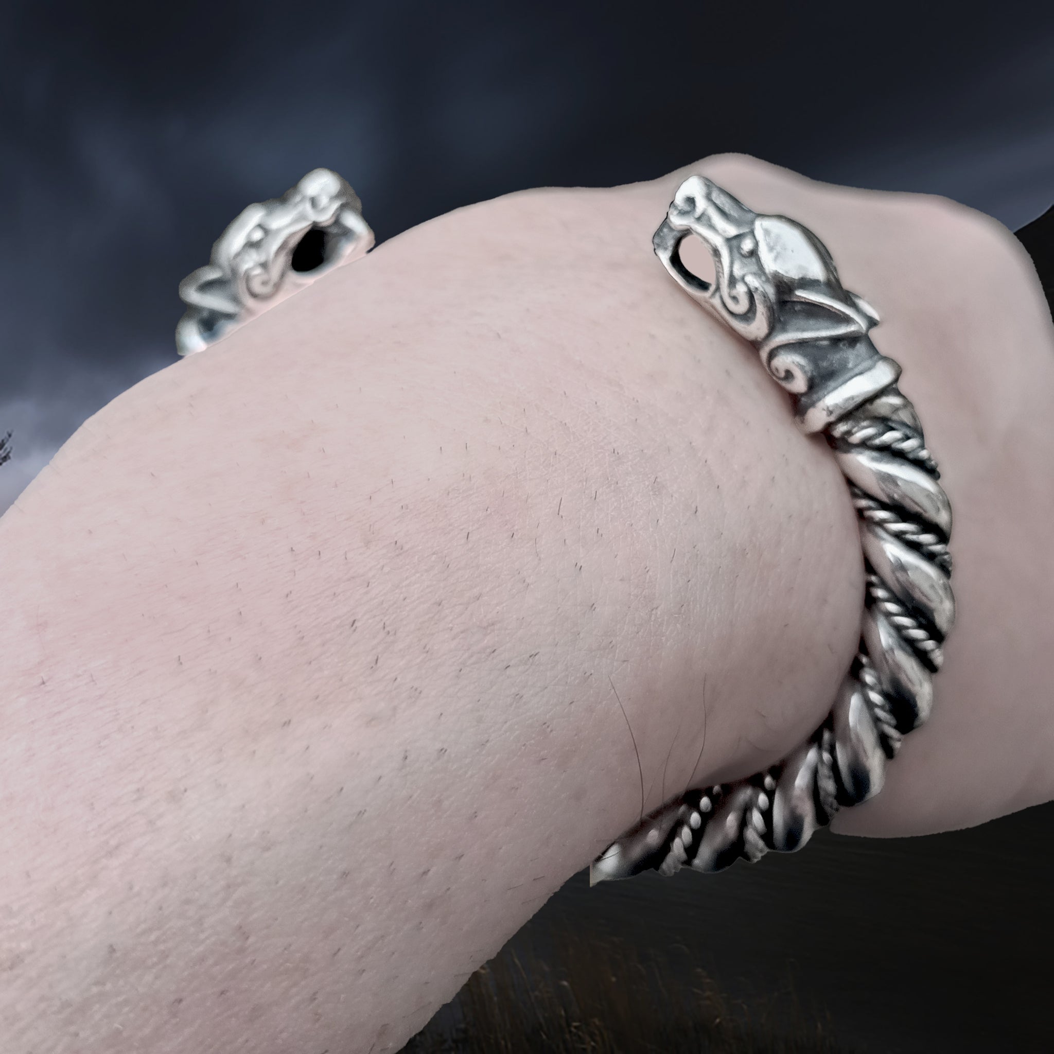 Thick Twisted Silver Viking Bracelet / Arm Ring With Ferocious Wolf Heads on Wrist - Close Up Angle View