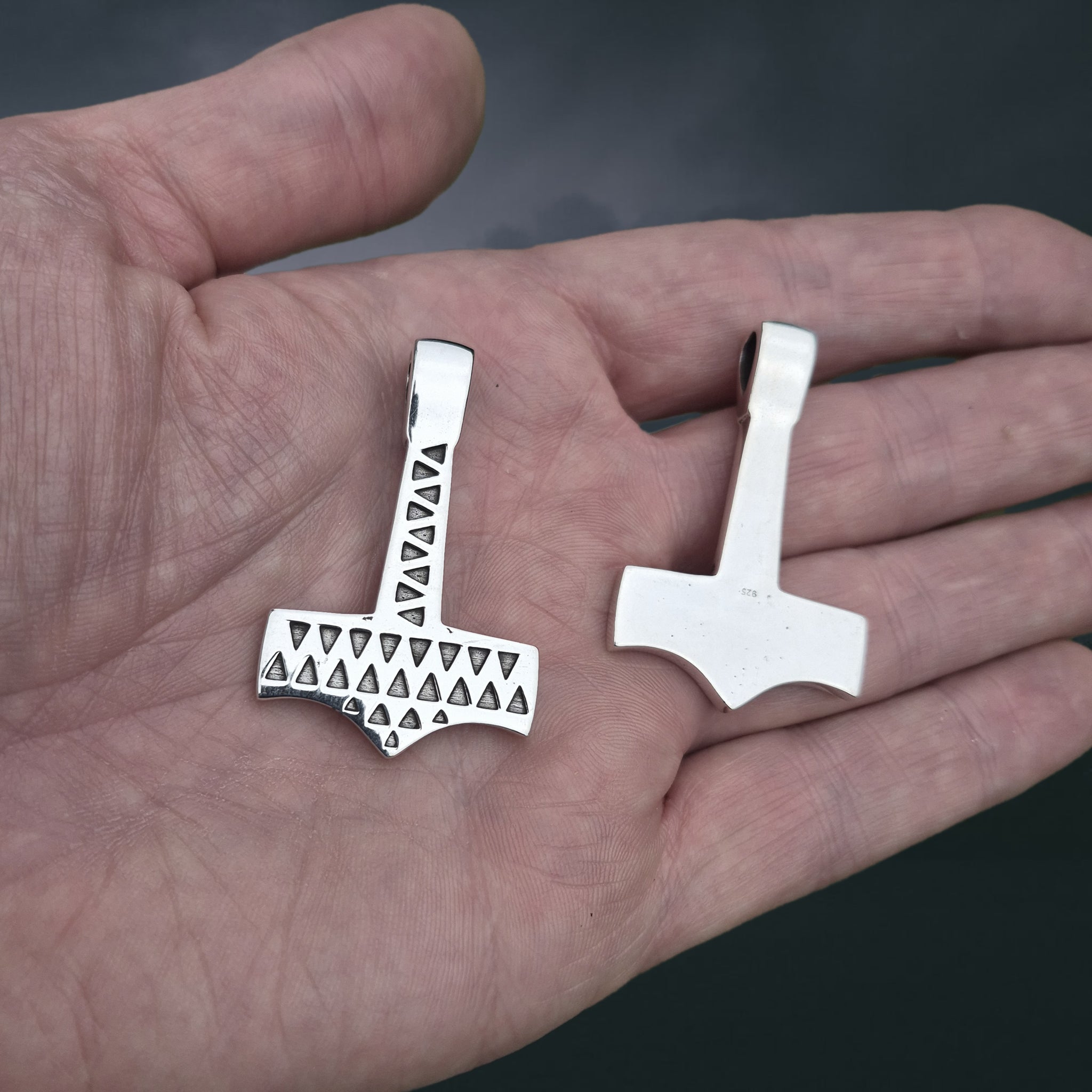 Silver Thors Hammer Pendant Replicas from Vålse, Denmark on Hand - Front and Back View