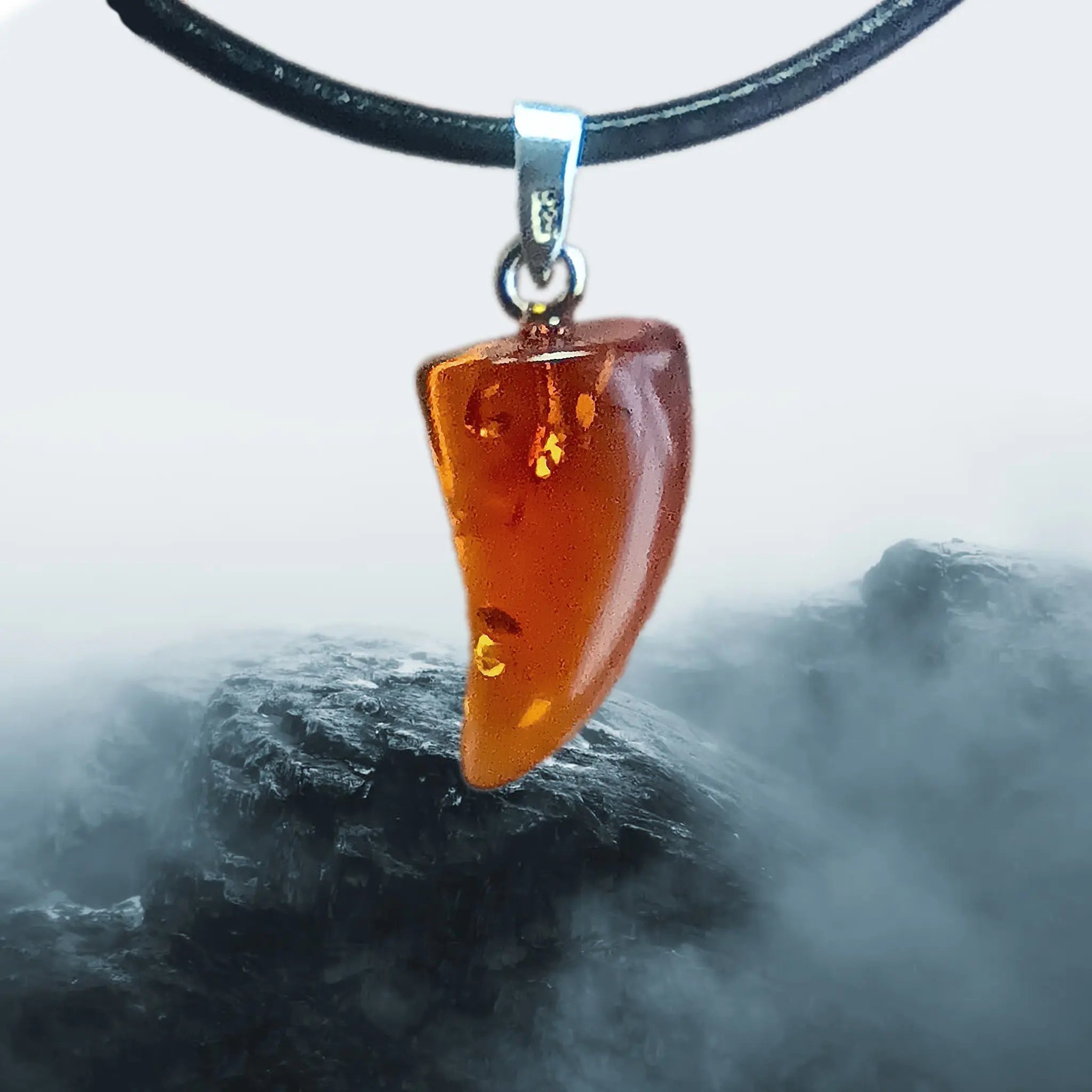 Hand-Cut & Polished Amber Pendant, Shaped into a Wolf's / Dragon's Tooth with Sterling Silver Hanger on Lather Cord
