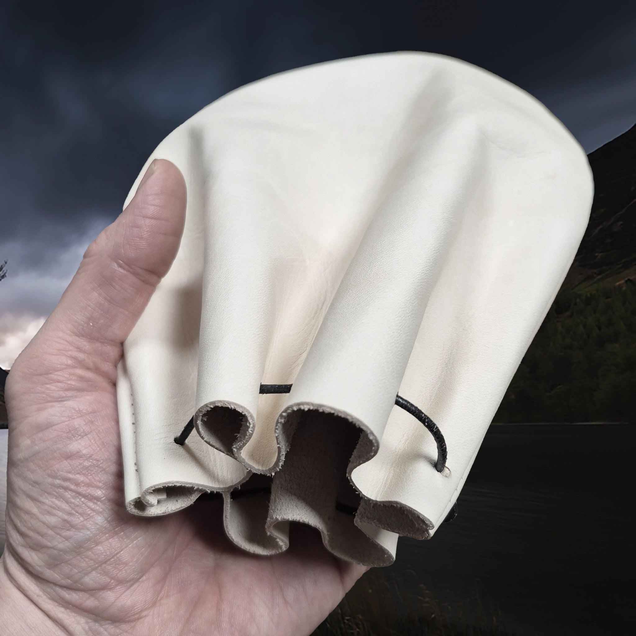 Large Natural Veg-Tan Leather Viking Pouch with Leather Drawstring on Hand - Angle View