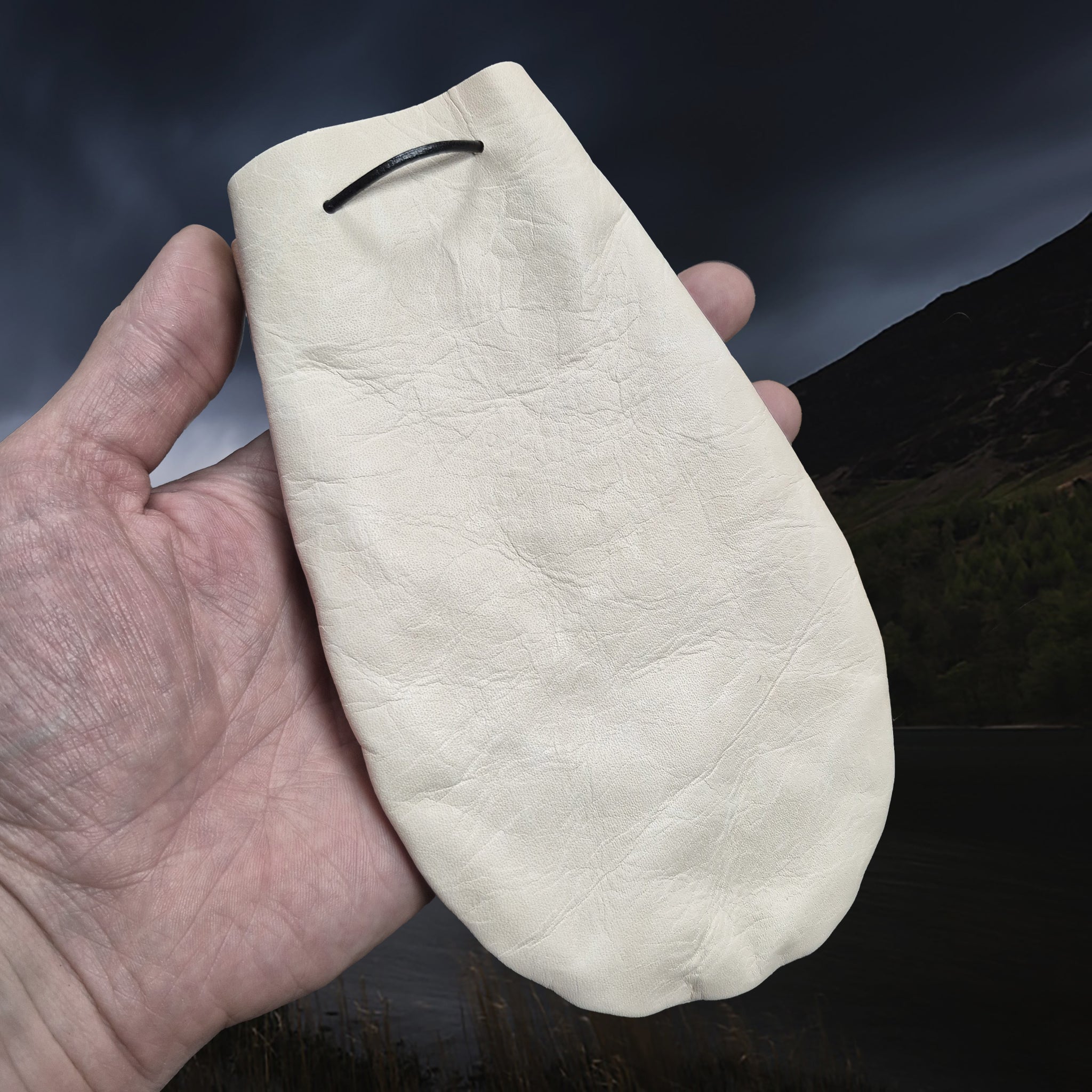 Medium Sized Natural Veg-Tan Leather Viking Pouch with Leather Drawstring on Hand