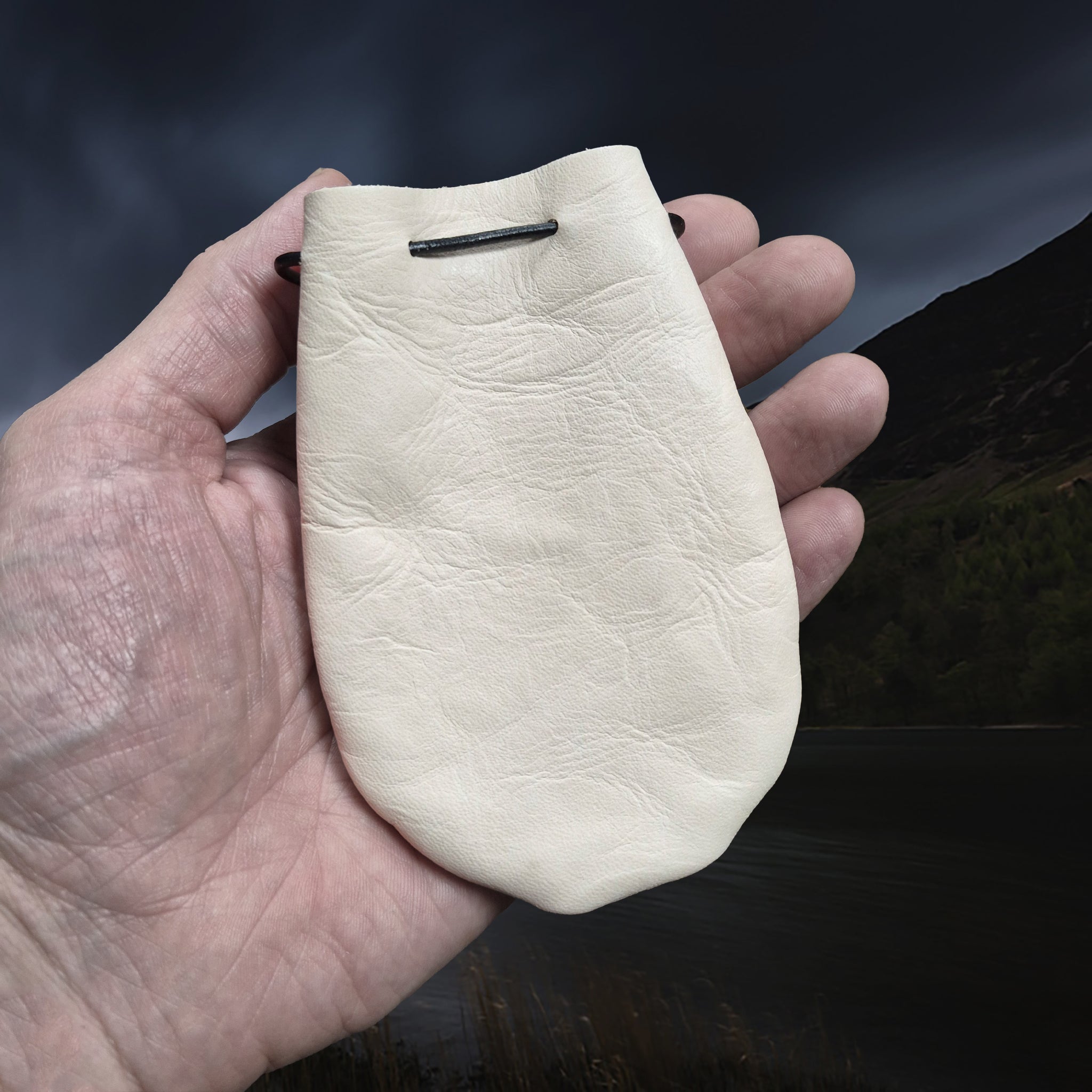 Natural Veg-Tan Leather Viking Pouch with Leather Drawstring Tie on Hand
