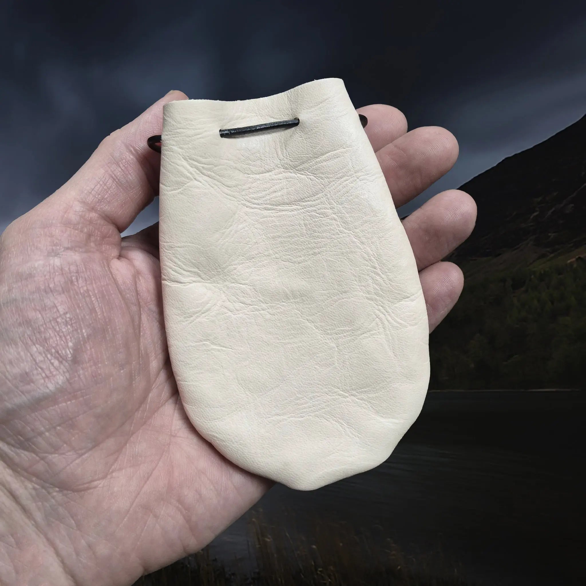 Natural Veg-Tan Leather Viking Pouch with Leather Drawstring Tie on Hand