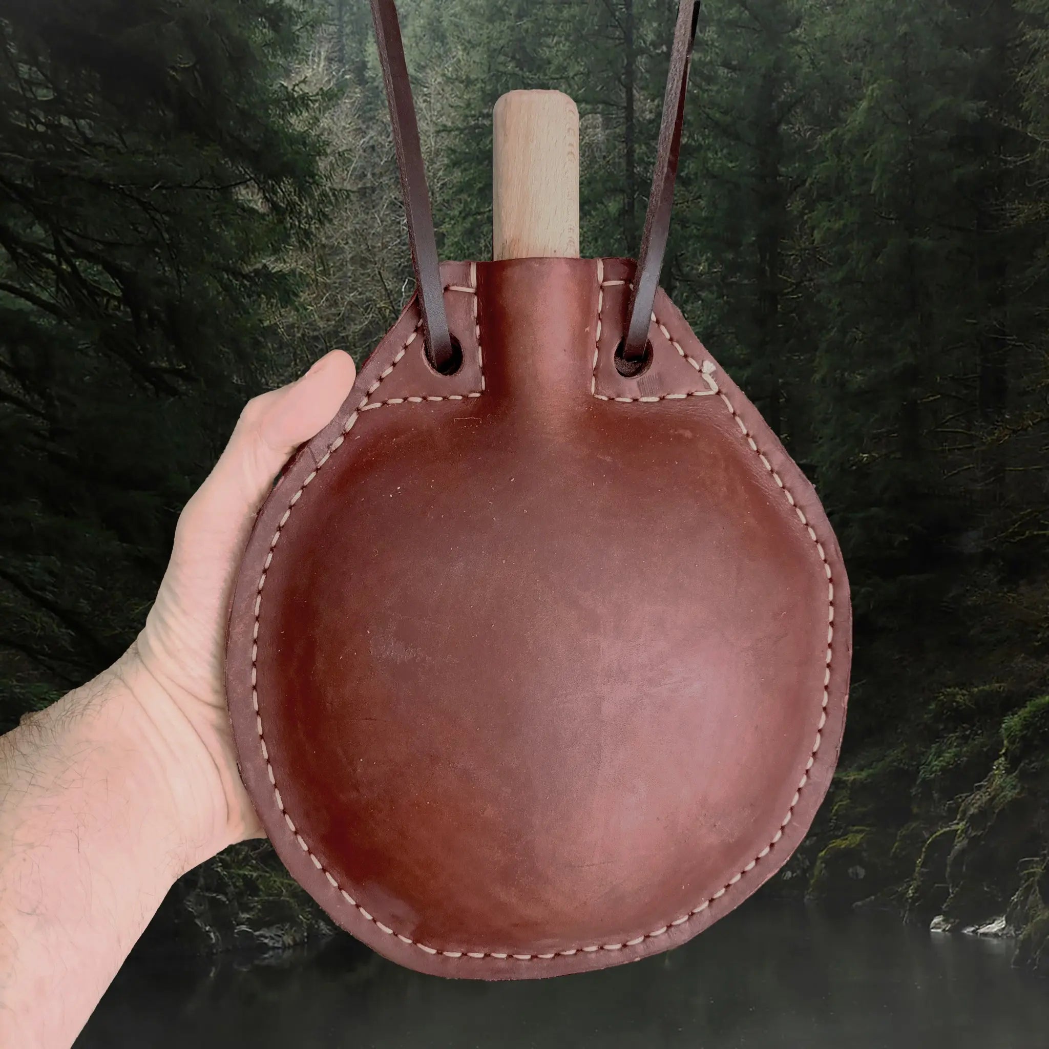 Handmade Thick Leather Water Bottle with Wood Stopper & Leather Carry Strap in Hand