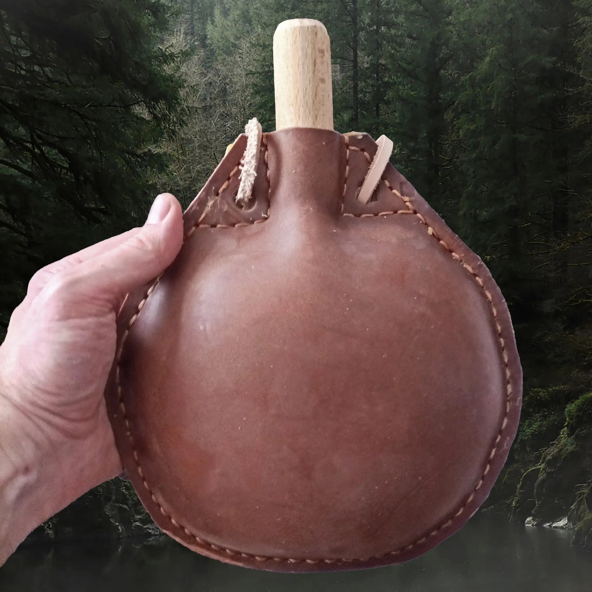 Handmade Thick Leather Water Bottle with Wood Stopper & Leather Carry Strap in Hand for Scale