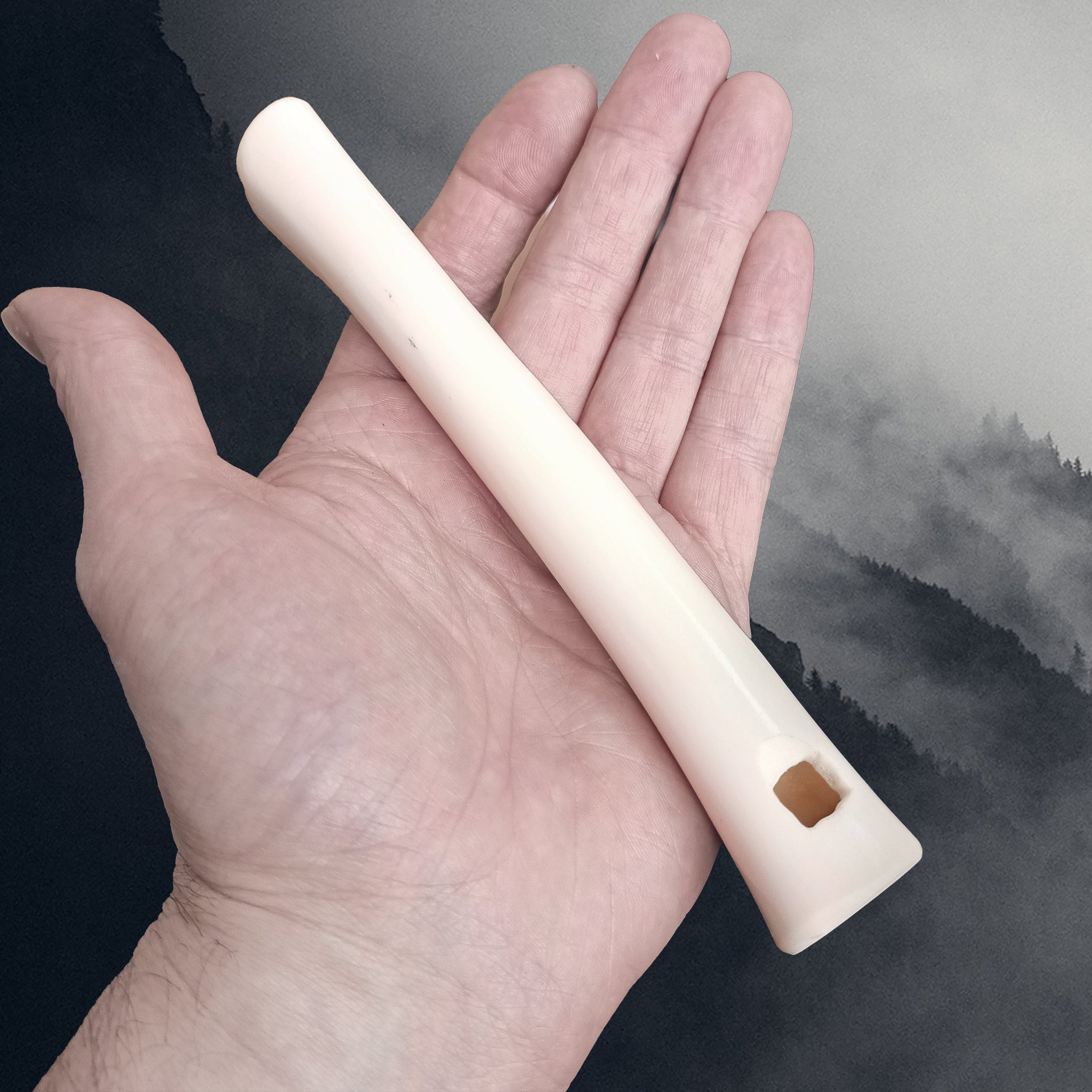 Replica Viking Age Bone Whistle on Hand