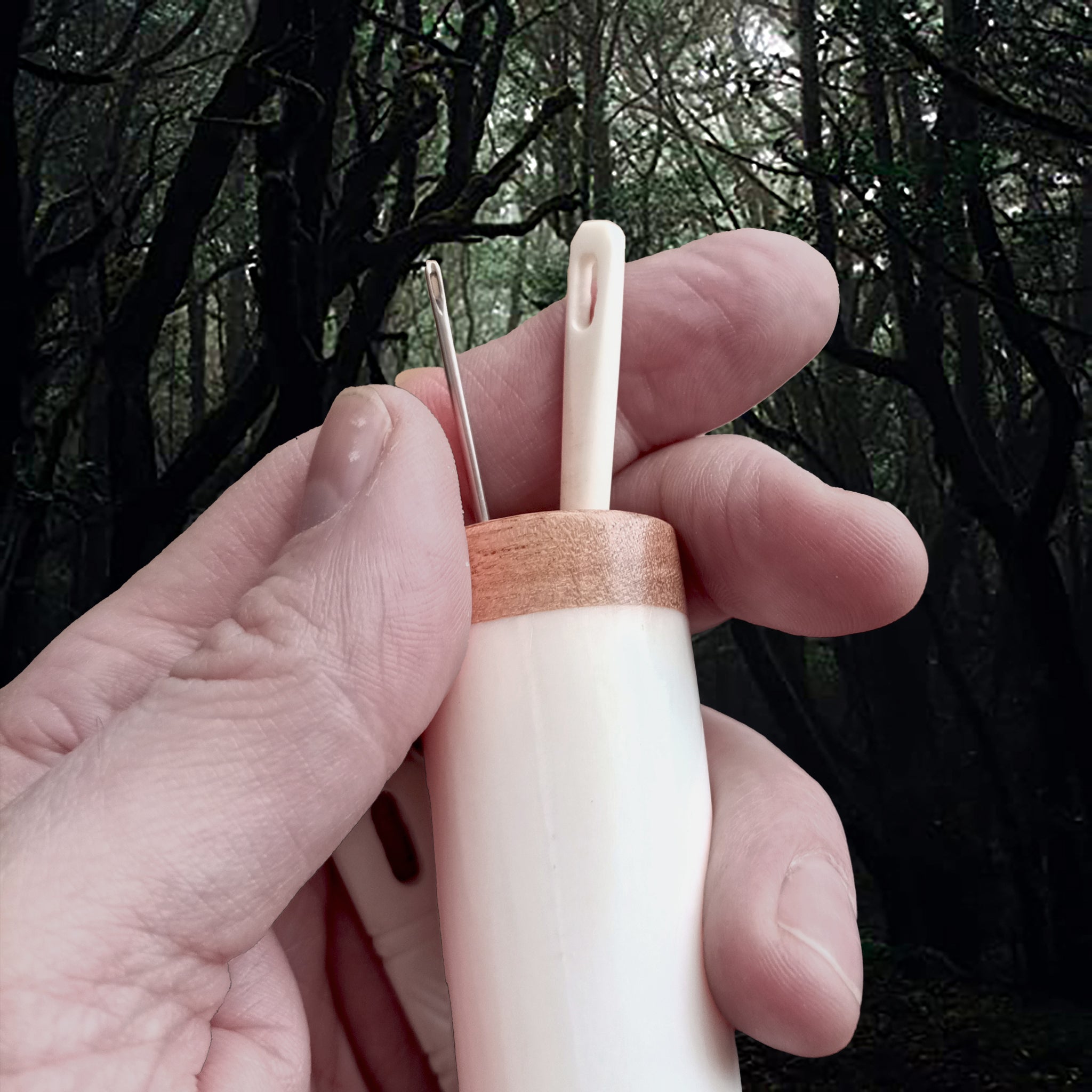 Large Bone Replica Viking Needle Case with Wooden Stopper in Hand - Showing Top with Needles