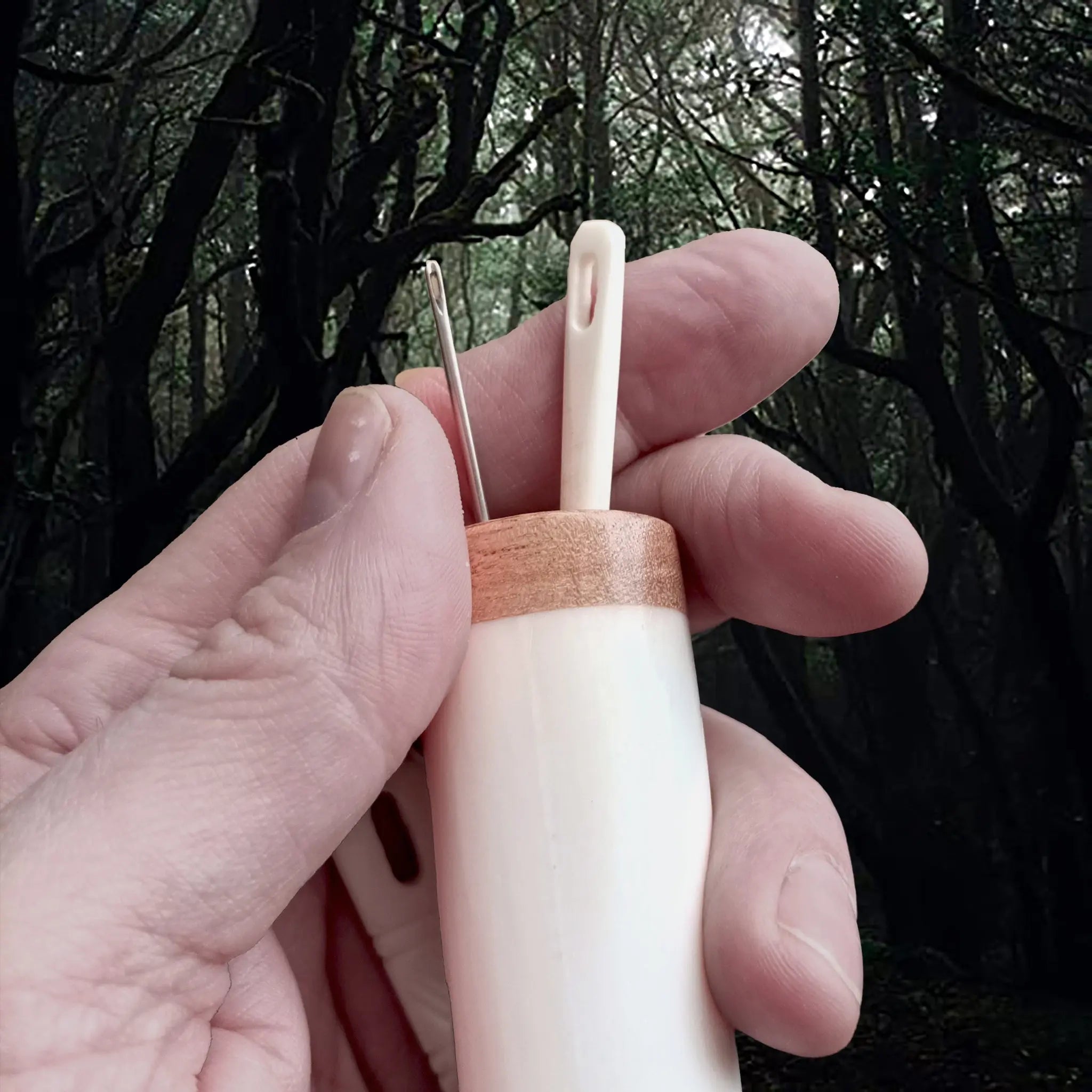 Large Bone Replica Viking Needle Case with Wooden Stopper in Hand - Showing Top with Needles