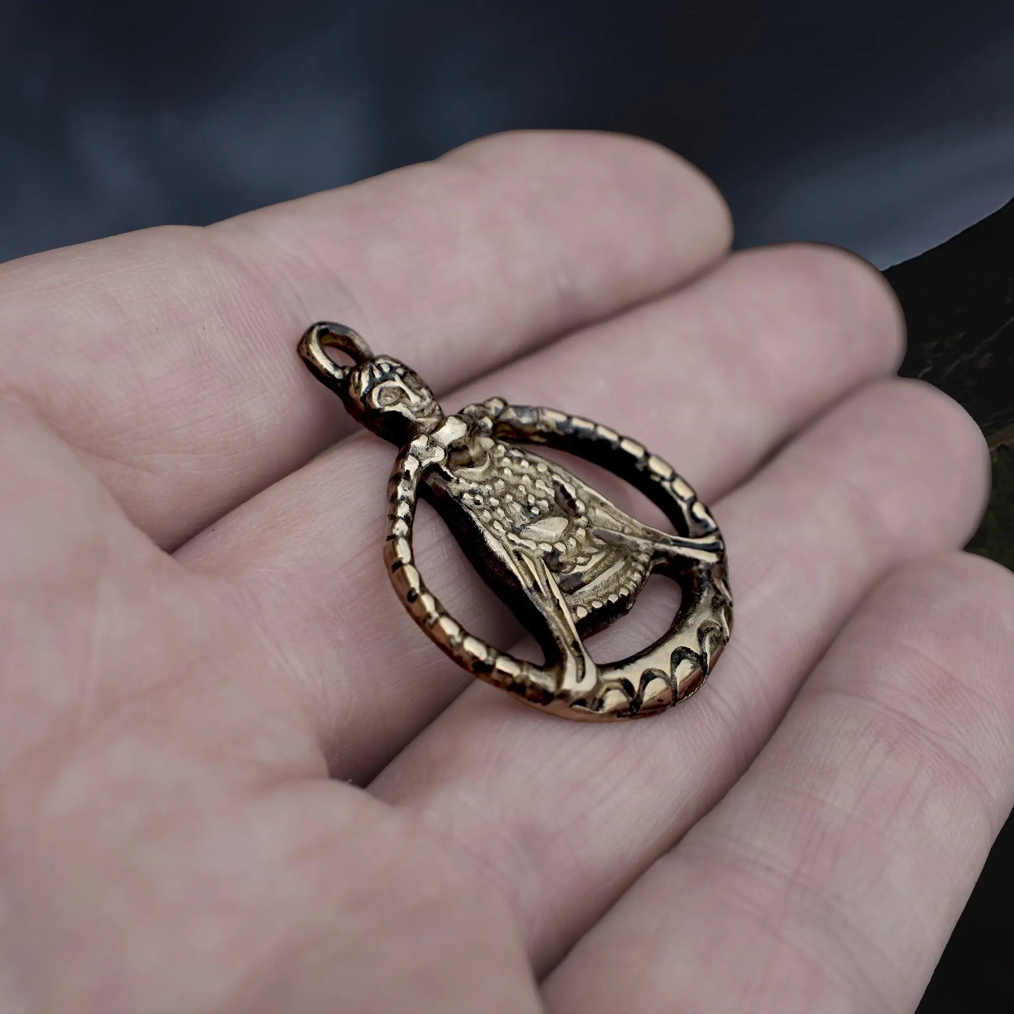 Large Bronze Circular Freya Pendant Replica with Top Loop on Hand - Side Angle View