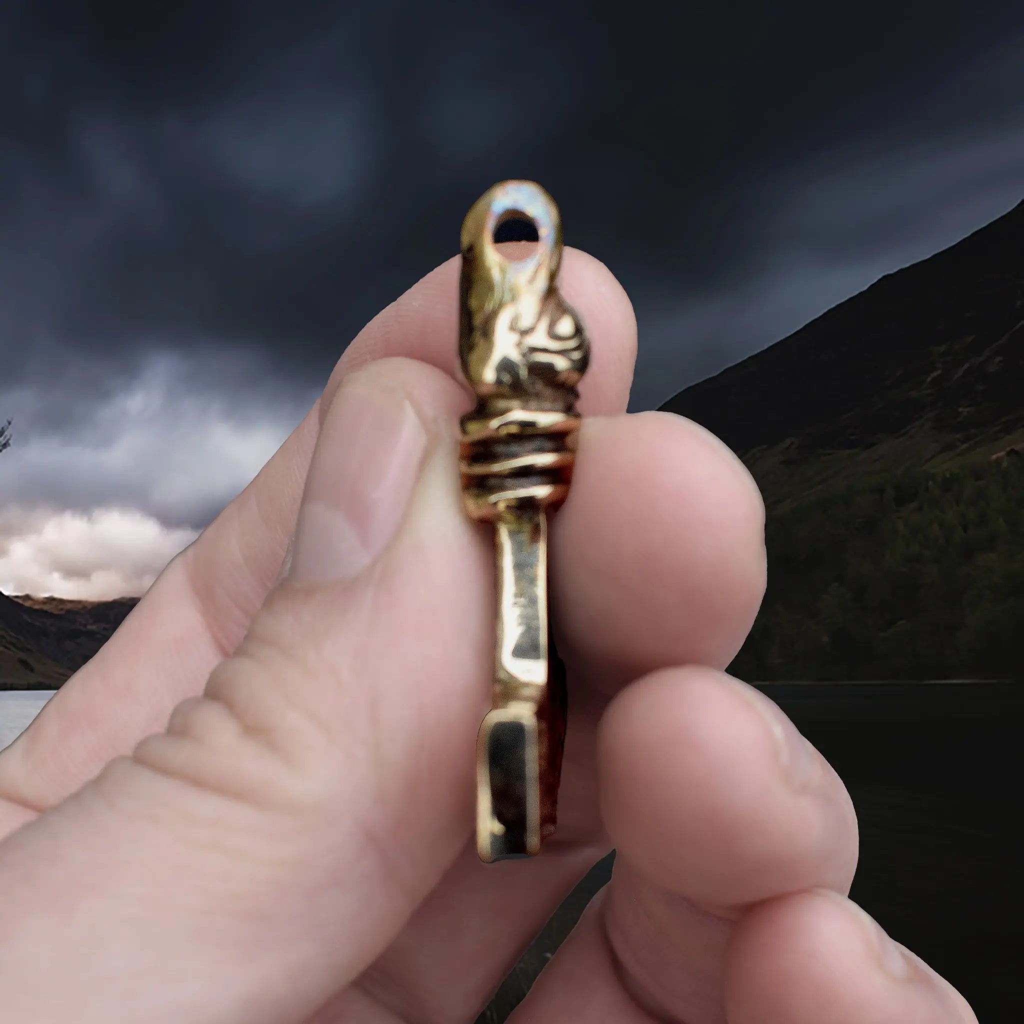 Replica Bronze Viking Age Thor's Hammer Pendant from Sweden with Raven Head in Fingers - Side View