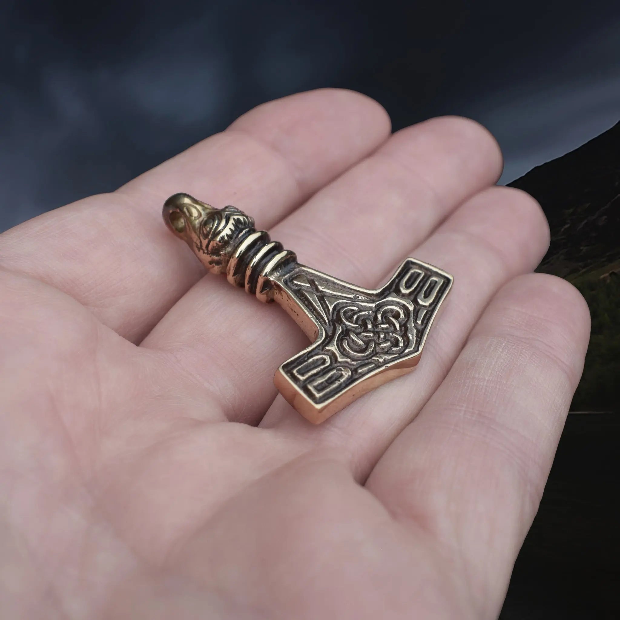 Replica Bronze Viking Age Thor's Hammer Pendant from Sweden with Raven Head on Hand - Angle View