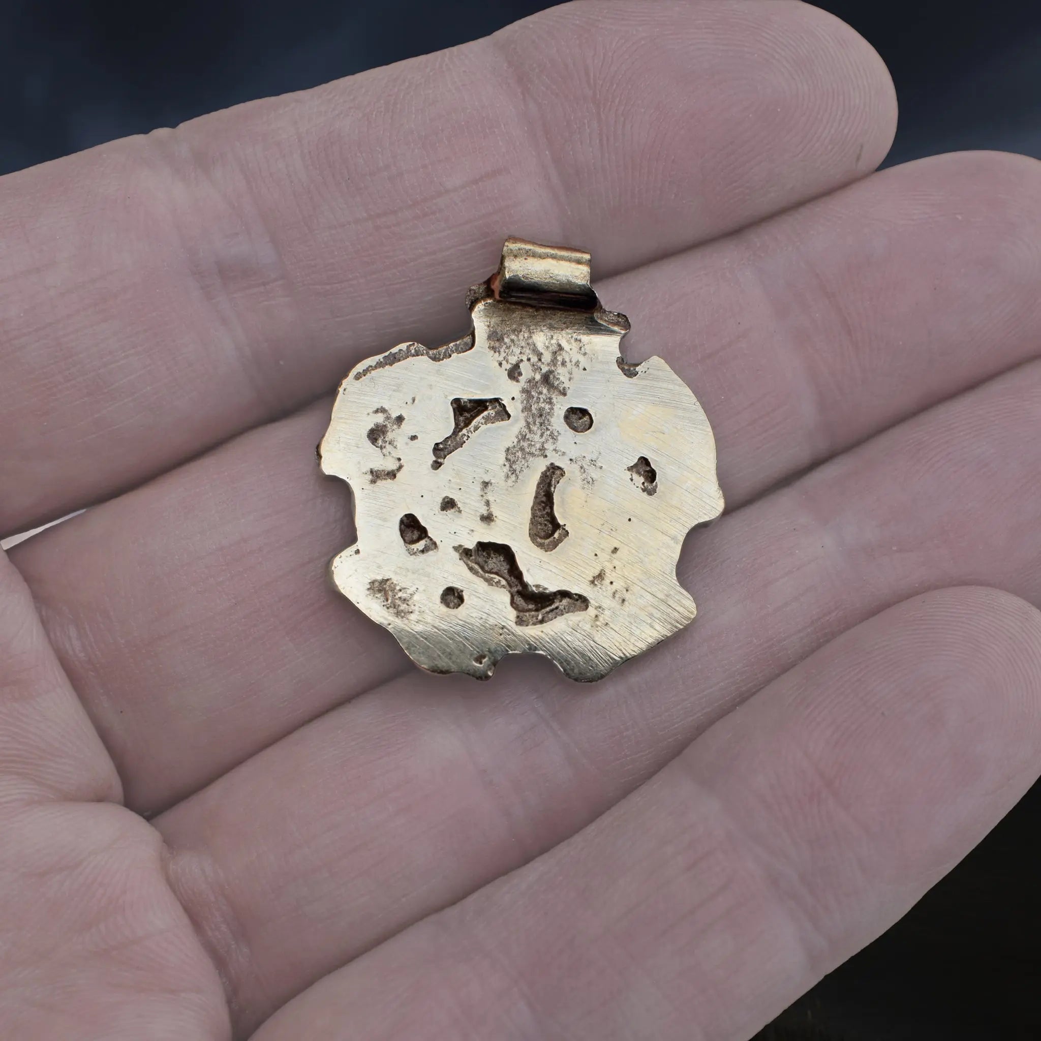 Solid Bronze Replica Viking Gripping Beats Pendant from 10th century Sweden on Hand - Back View