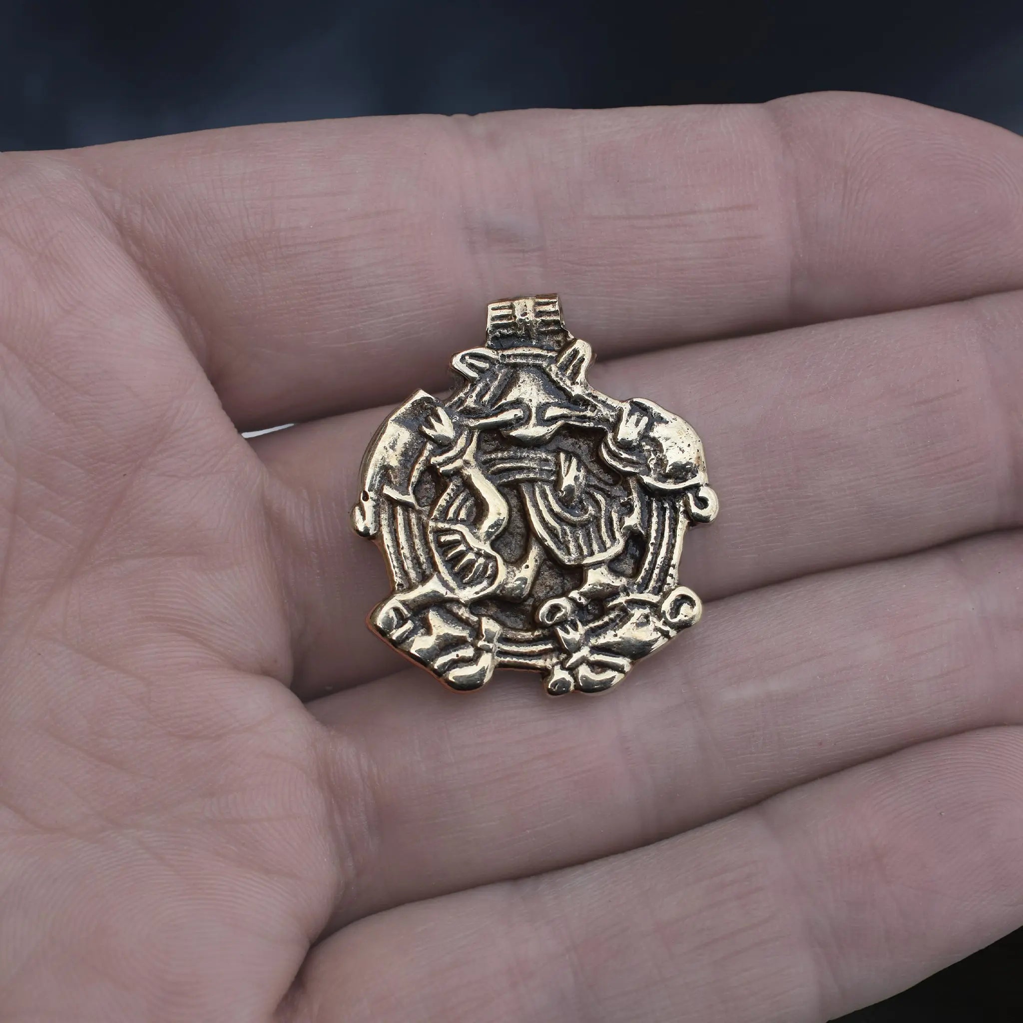 Solid Bronze Replica Viking Gripping Beats Pendant from 10th century Sweden on Hand