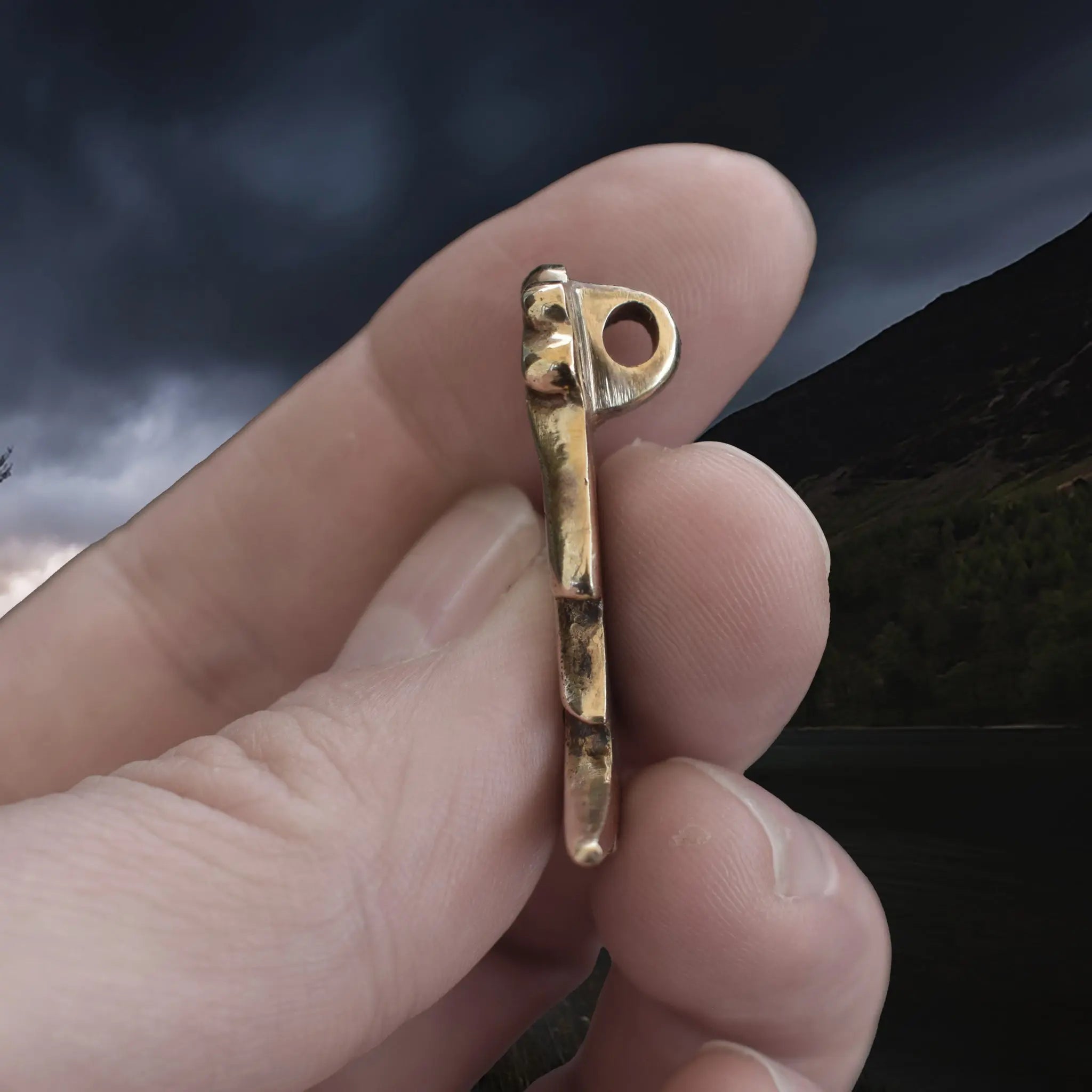 Large Bronze Valkyrie Viking Pendant Replica from Sweden in Fingers - Side View