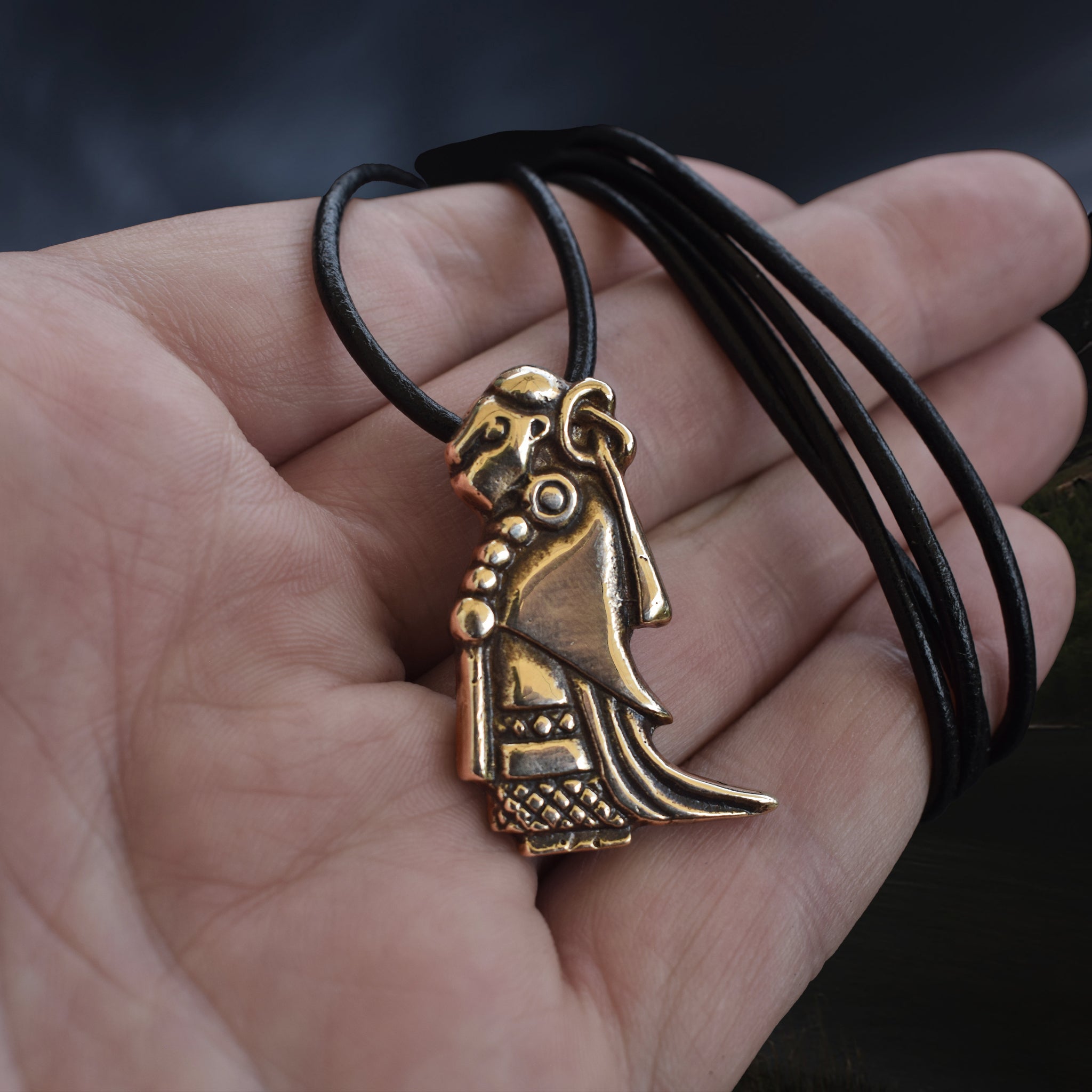 Large Bronze Valkyrie Viking Pendant Replica from Sweden on Leather Cord - on Hand - Angle View