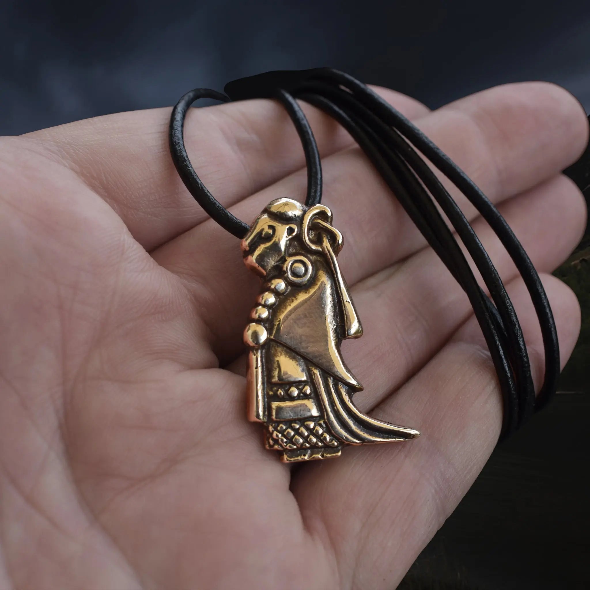 Large Bronze Valkyrie Viking Pendant Replica from Sweden on Leather Cord - on Hand - Angle View