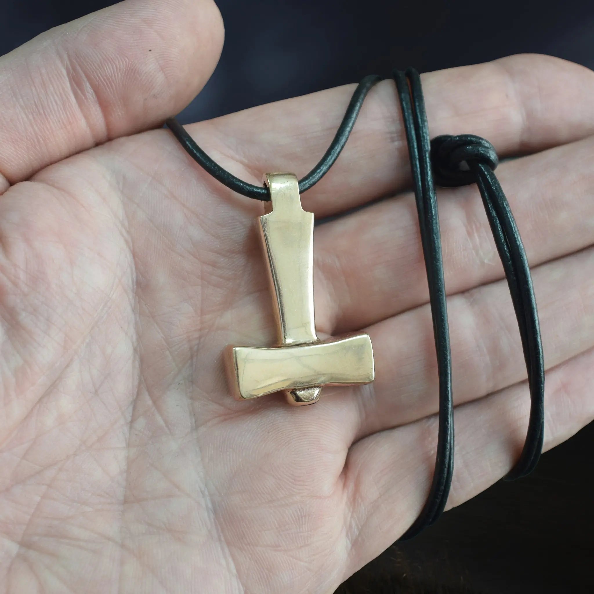 Bronze Replica Thors Hammer Pendant from Läby, Sweden on Leather Cord, on Hand - Further Away