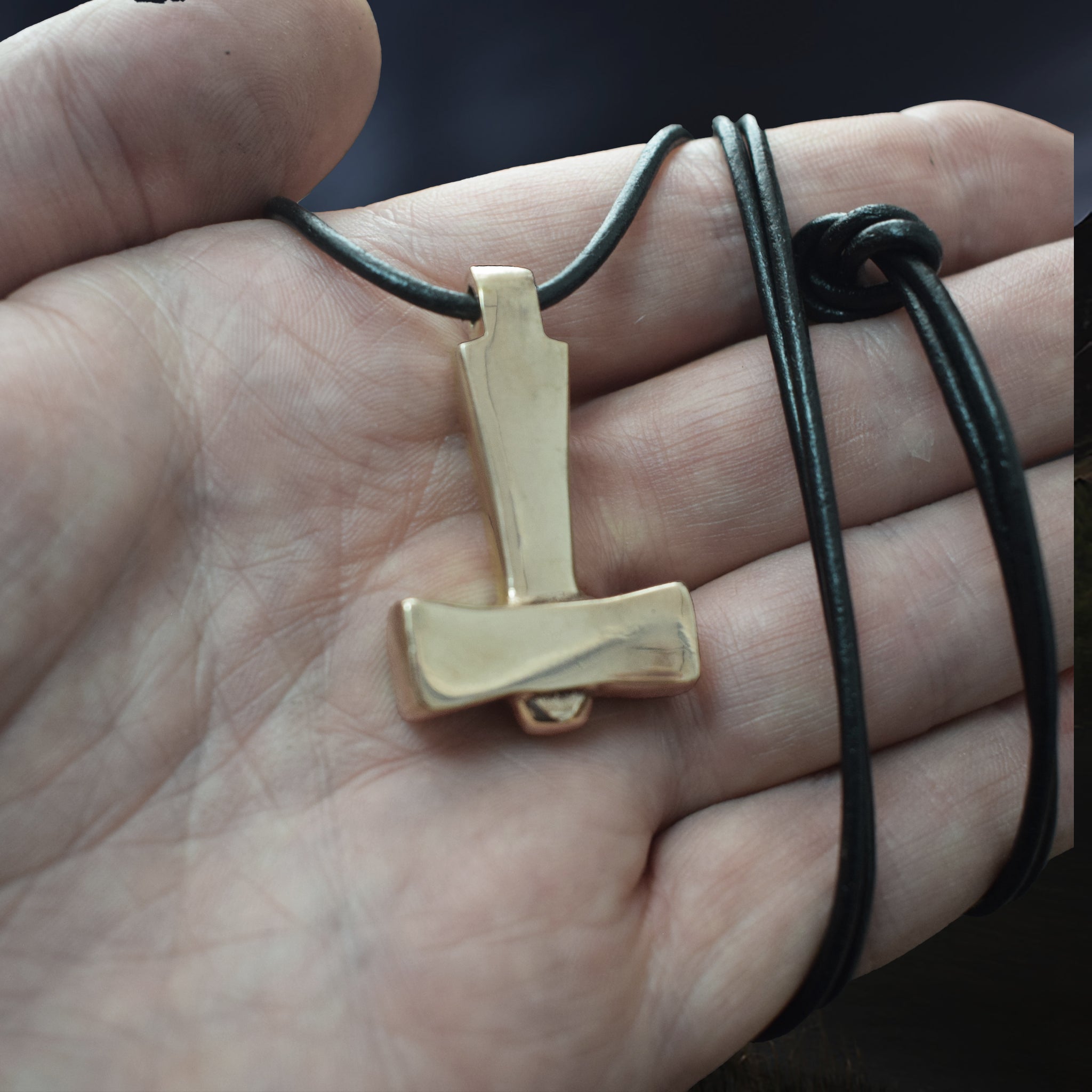 Bronze Replica Thors Hammer Pendant from Läby, Sweden on Leather Cord, on Hand