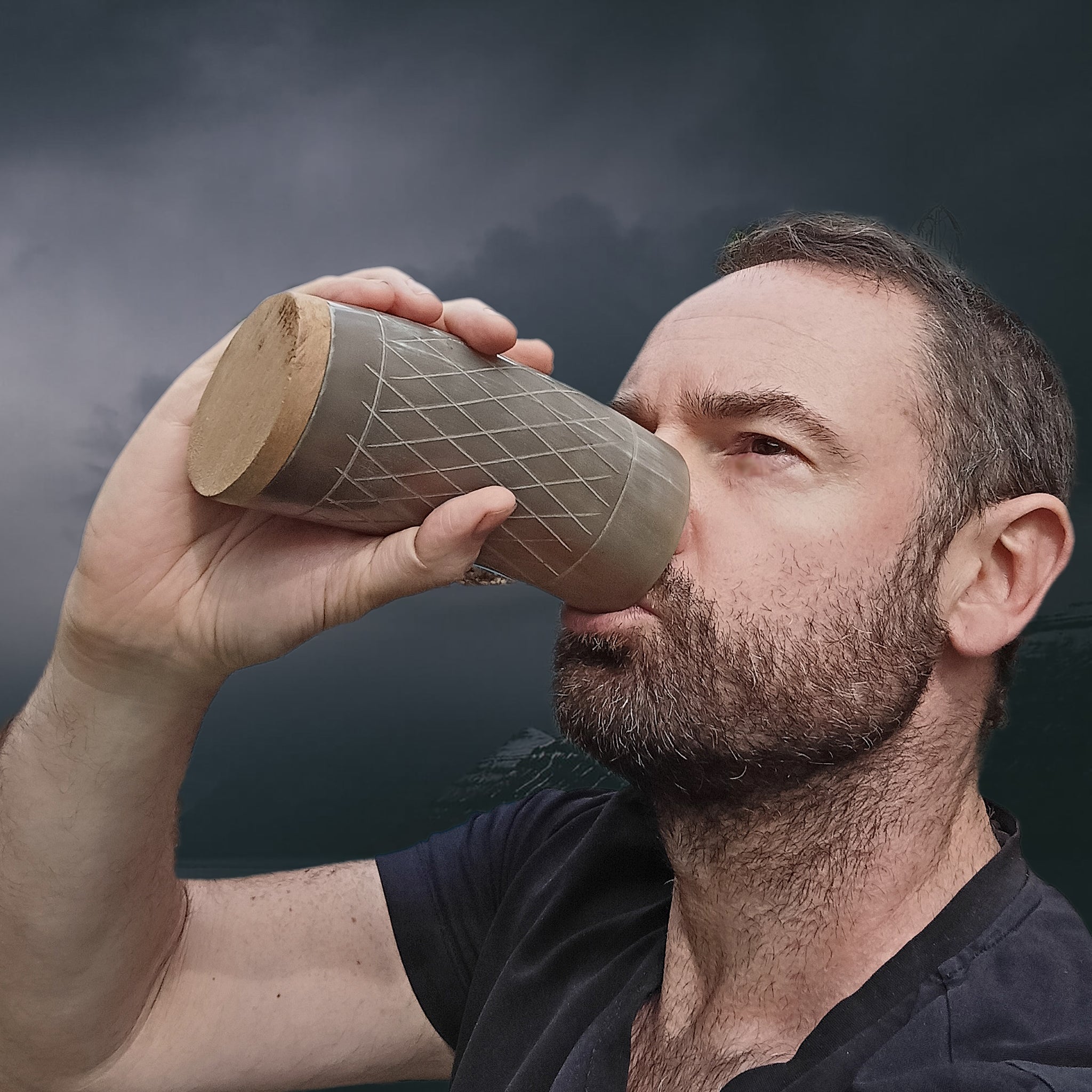 Drinking from a Polished Horn Beer Beaker with Wood Base and Carved Design