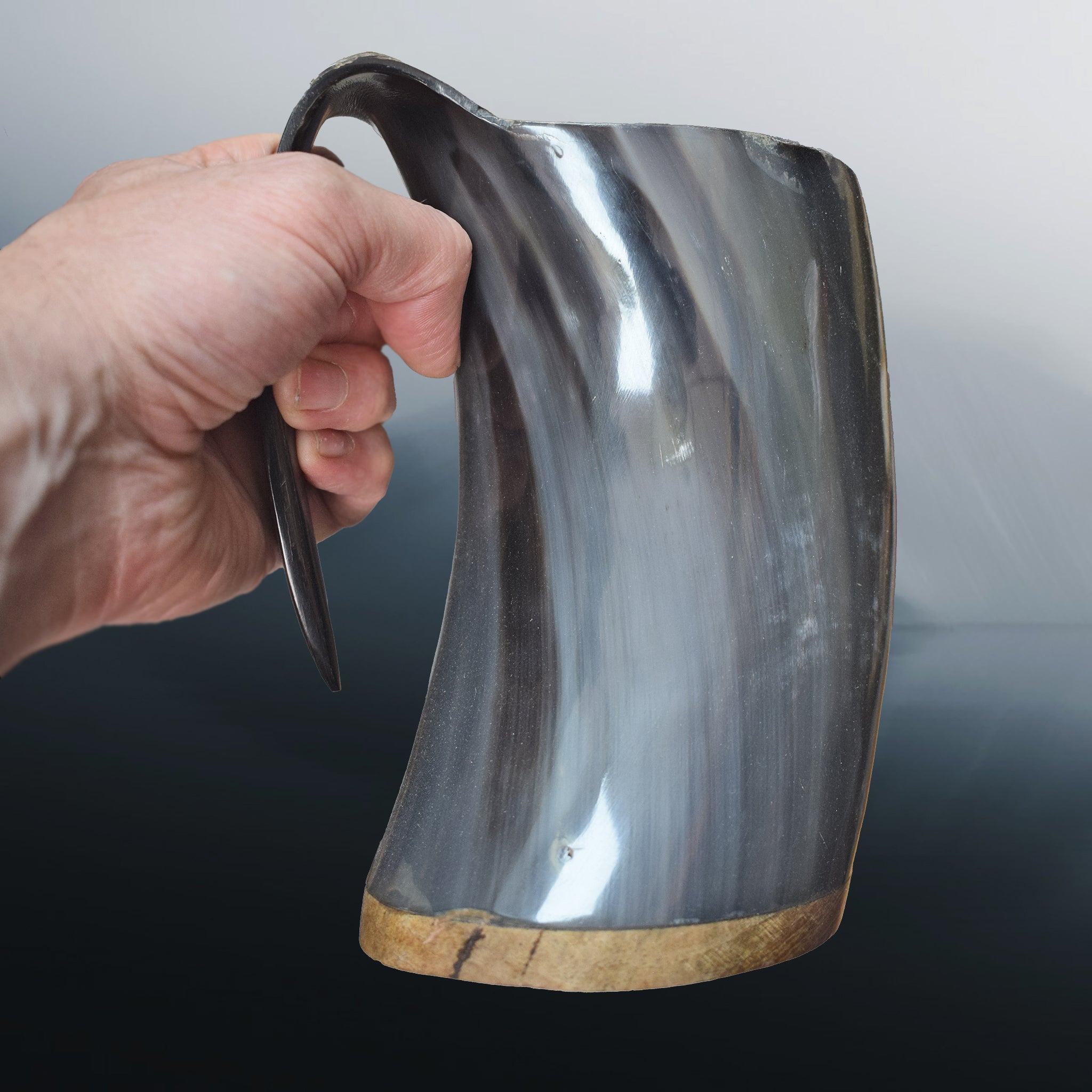 Large Polished Ox Horn Beer Mug in Hand - Side View