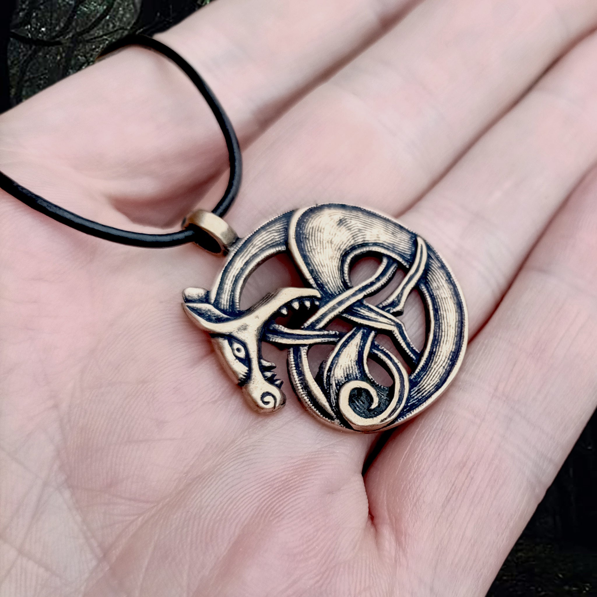 Bronze Fenrir Viking Wolf Pendant on Hand - Angle View - Viking Jewelry