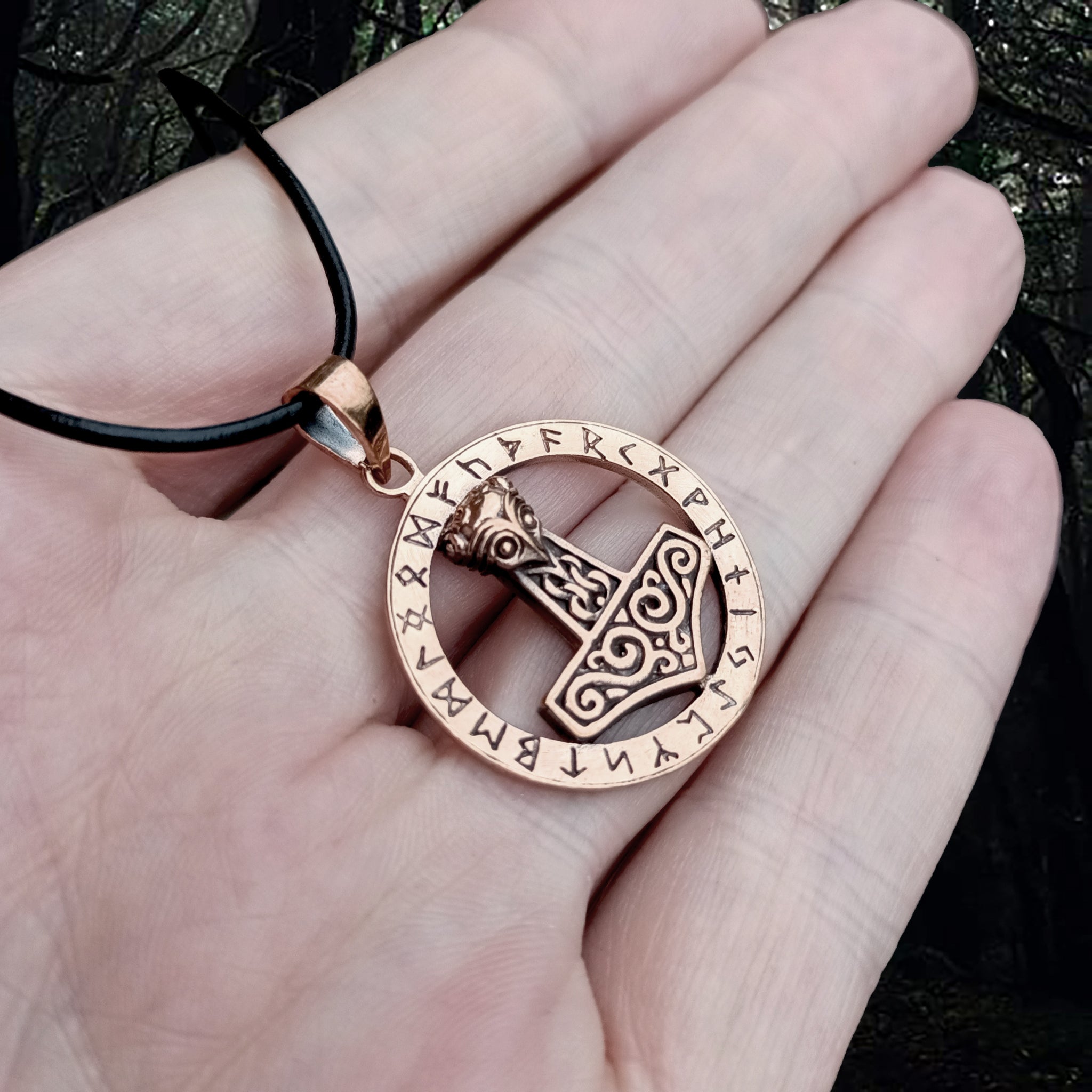 Round Bronze Runic Thors Hammer Viking Pendant on Hand - Angle View - Viking Jewelry