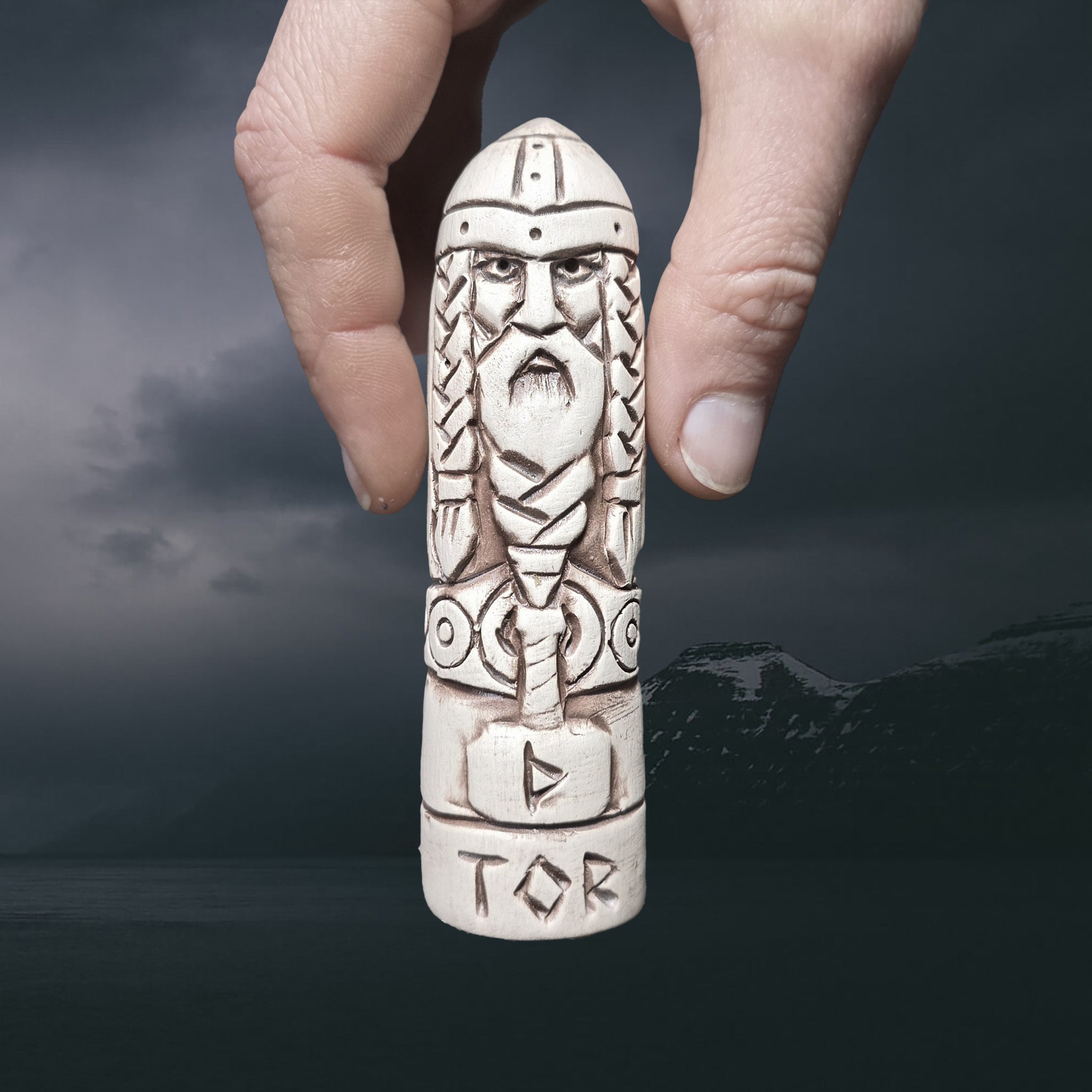 Statuette of the Norse God Thor in Hand-Crafted Clay with Hand for Scale