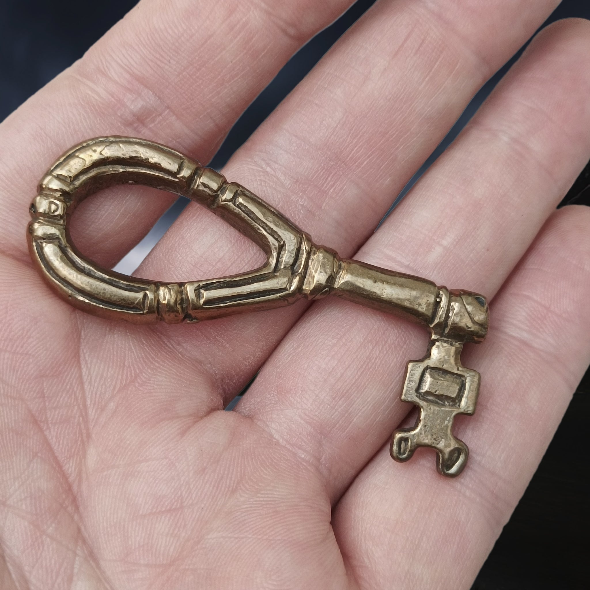 Large round Viking key with decorated design from Sweden on Hand