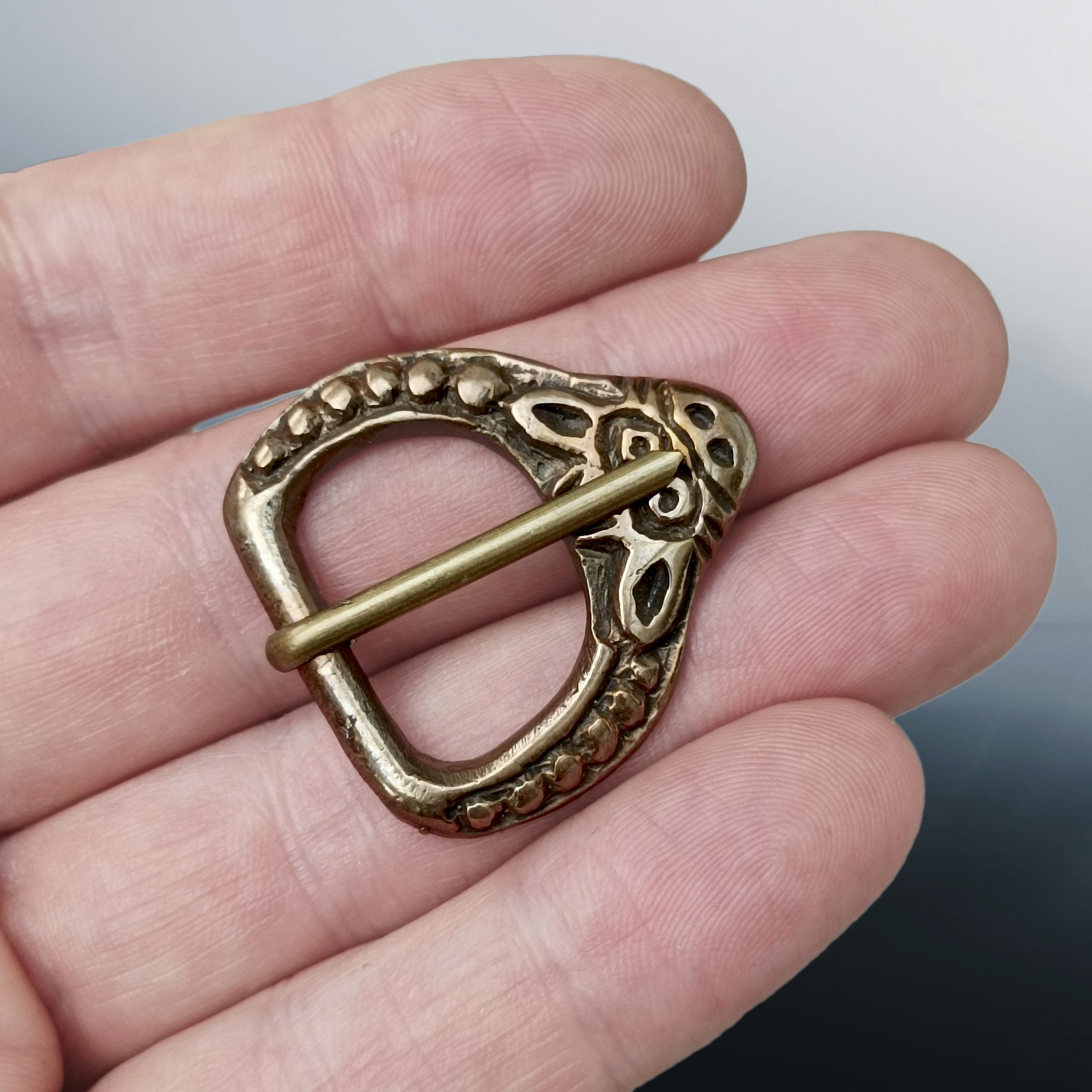 9th - 11th Century Replica Viking Bronze Buckle with Animal Head on Hand