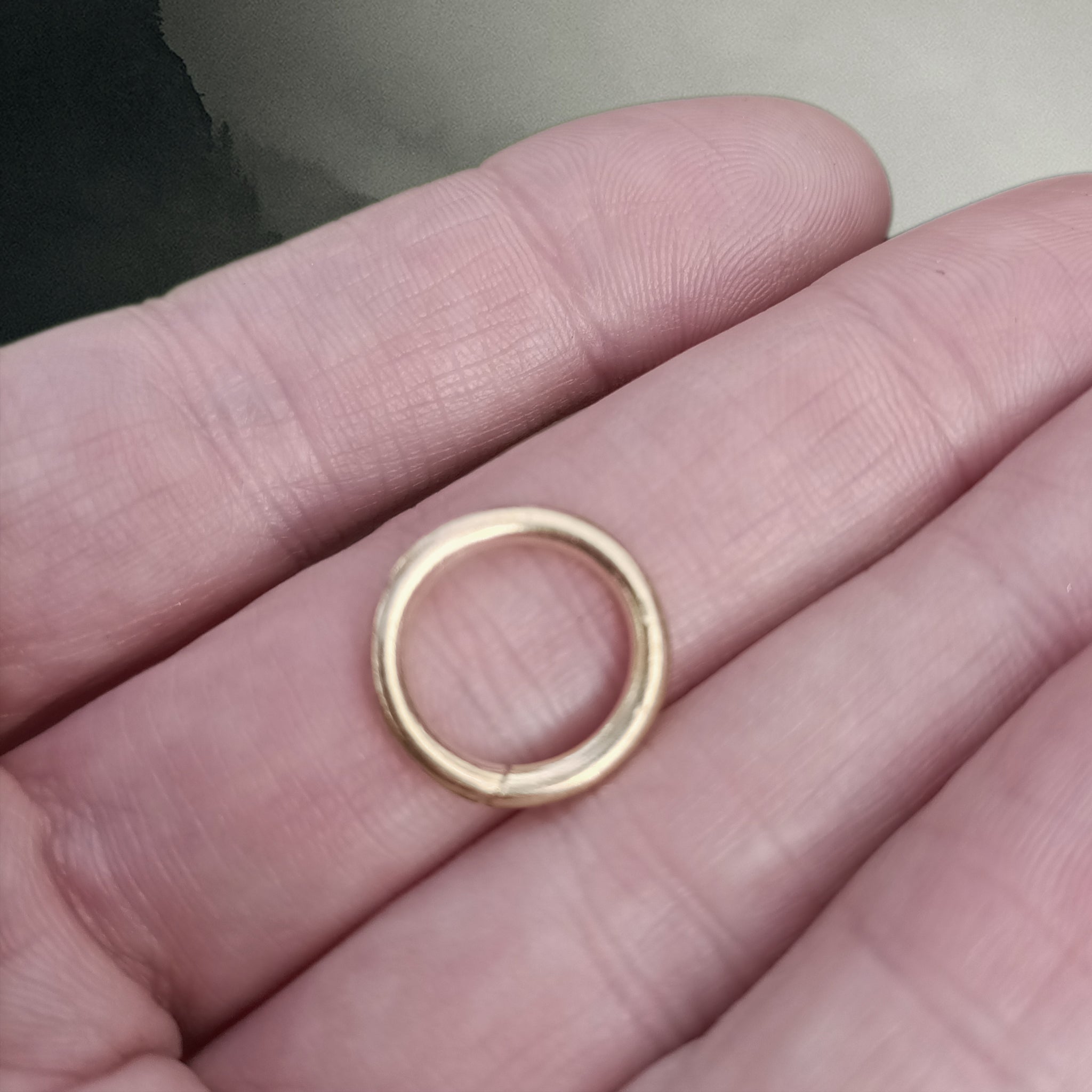 Small Brass Simple Split Ring on Hand - Viking Jewelry Fittings