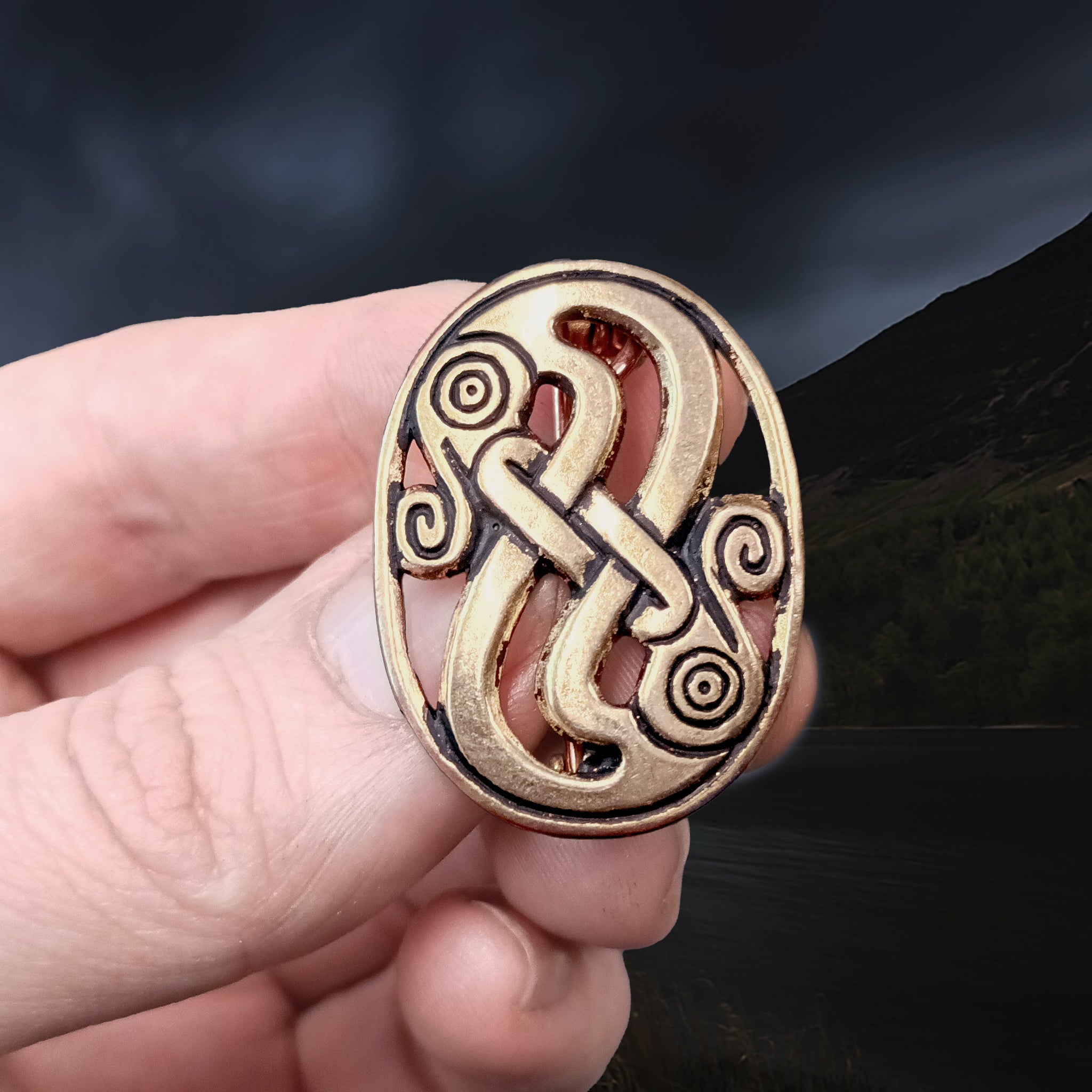 Bronze Gotland Viking Serpent Brooch in Fingers