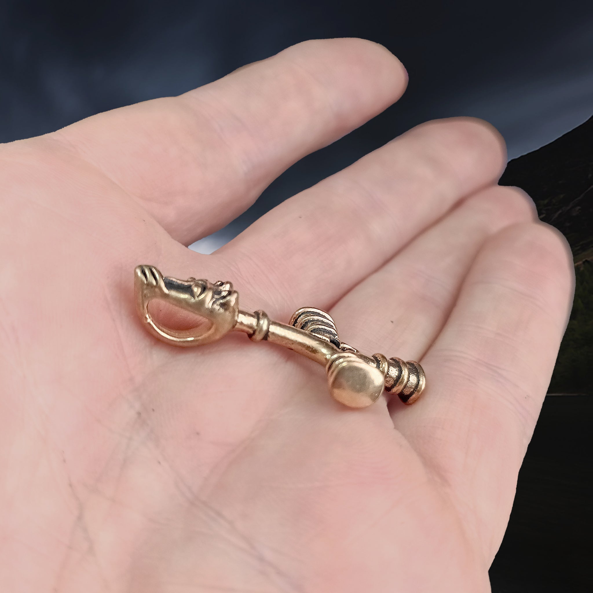 Bronze Wolf Cross Thors Hammer Pendant on Hand - Side Angle View