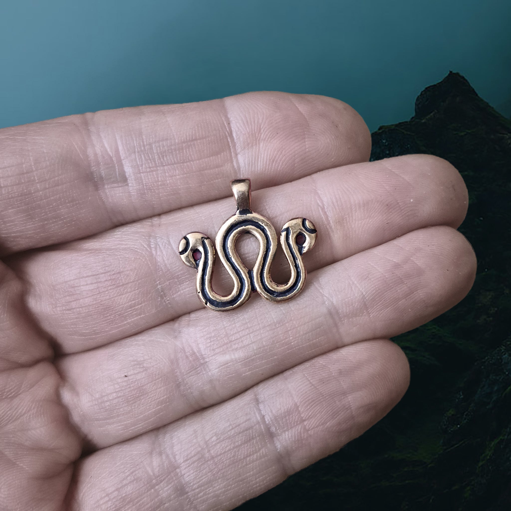 Viking Age Replica Bronze Serpent Bead Divider from Sweden on Hand