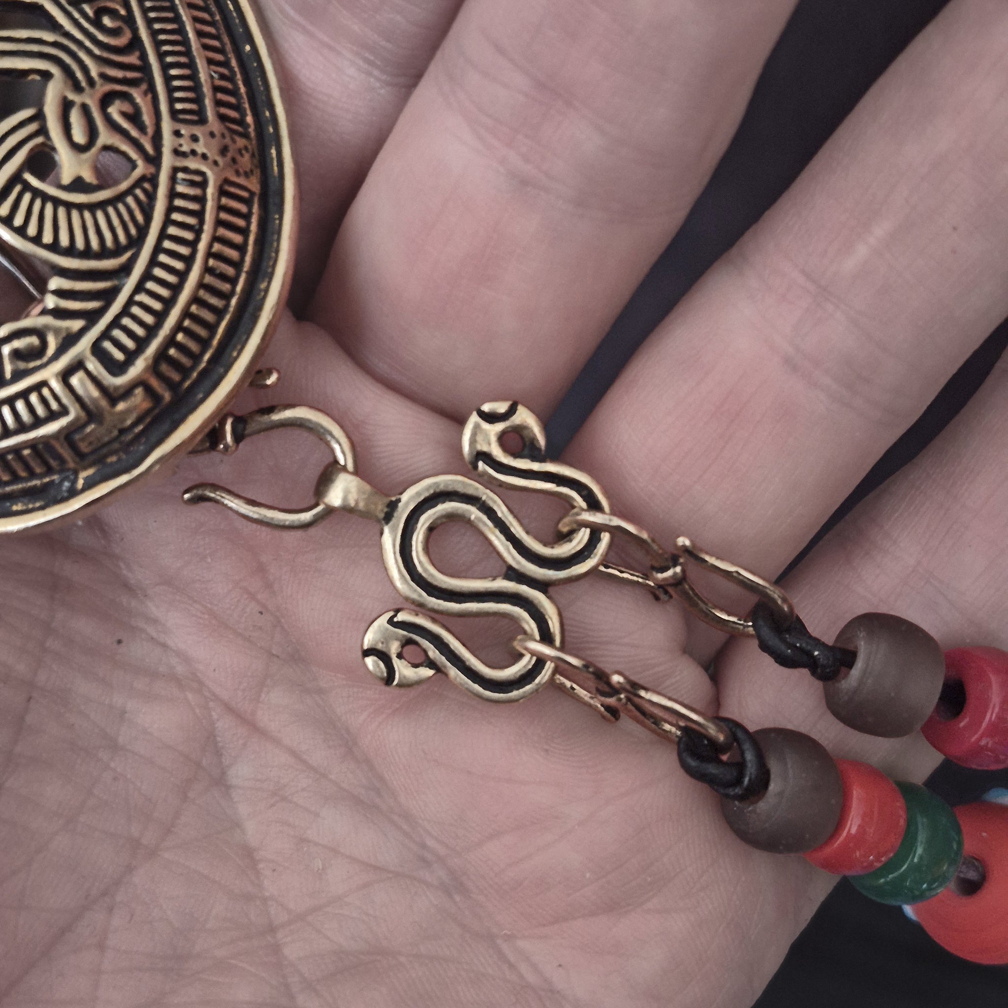 Viking Age Replica Bronze Serpent Bead Divider from Sweden with Bronze Hooks, Glass Viking Beads and Bronze Jelling Tortoise Brooch on Hand